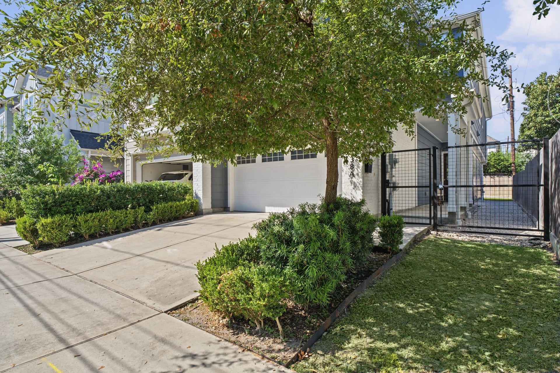 1538 Vermont Street, #A, Houston, TX 77006 Thoughtfully landscaped grounds, mature greenery, and a generous driveway create an appealing introduction to the home.