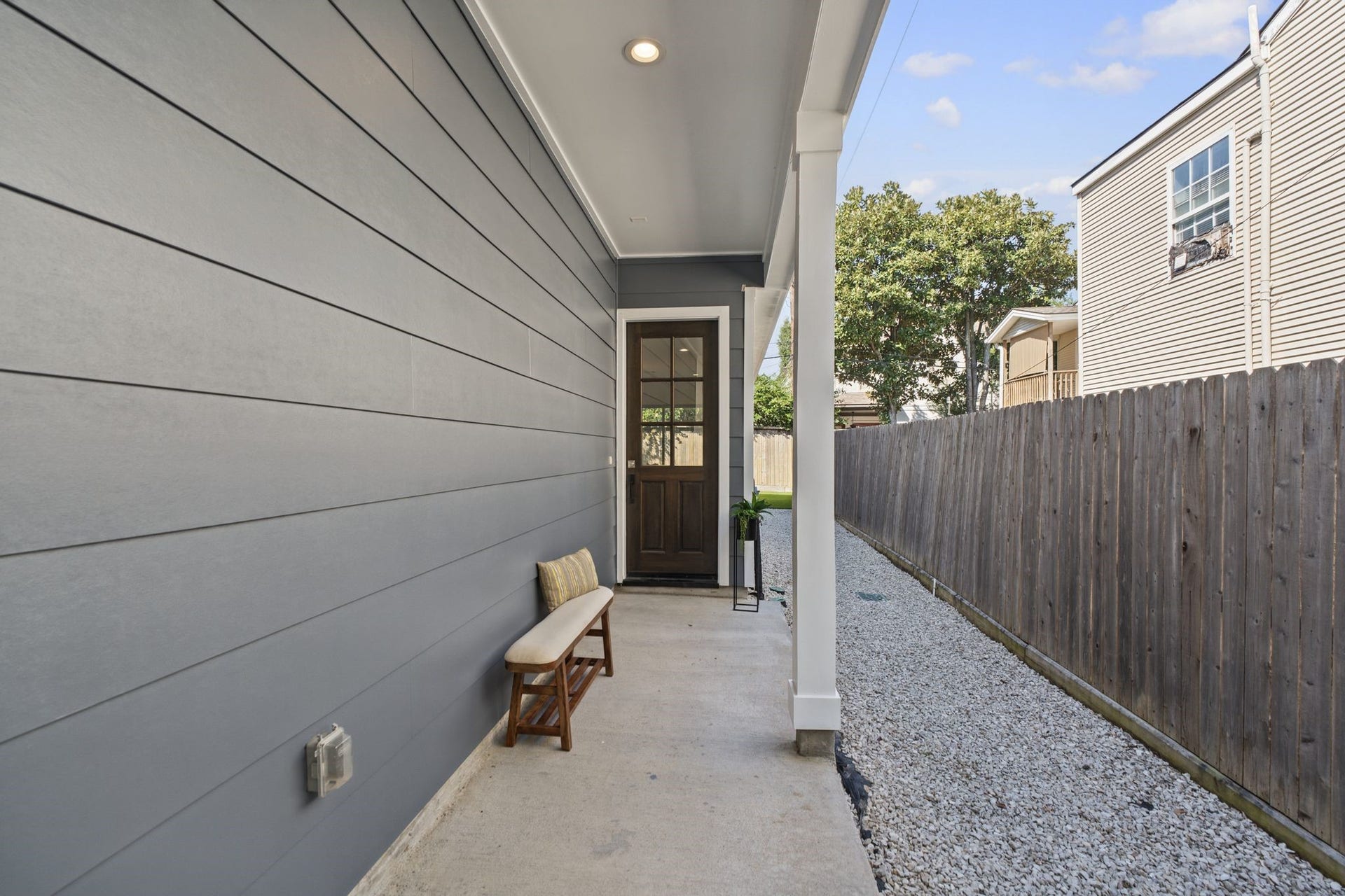 1538 Vermont Street, #A, Houston, TX 77006 A covered entry framed by clean architectural lines and a contemporary glass-paneled door sets the tone for the refined interiors beyond.