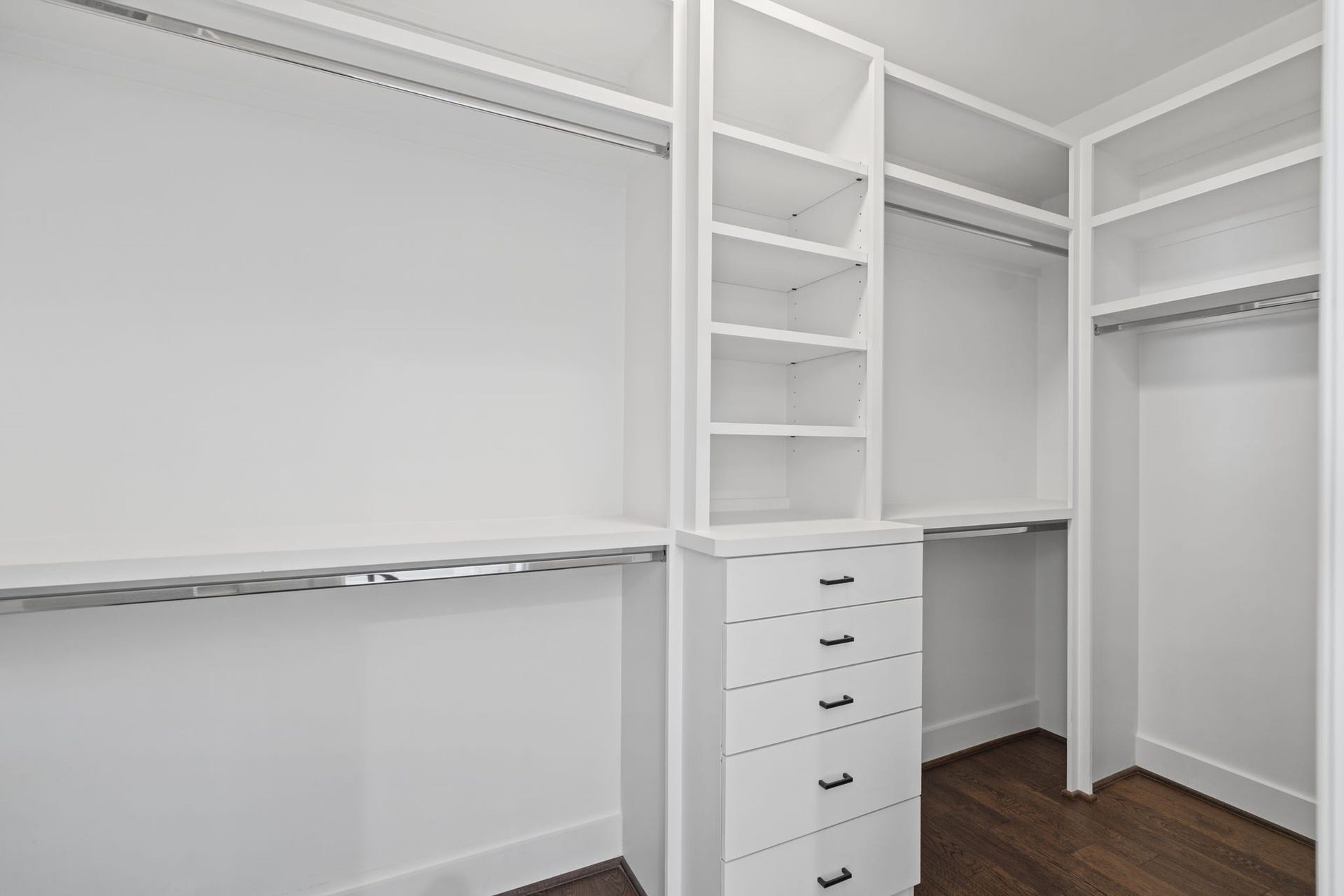 1538 Vermont Street, #A, Houston, TX 77006 Custom-style built-in organization with generous hanging space, shelving, and drawers offers an elegant, practical solution for wardrobe storage.