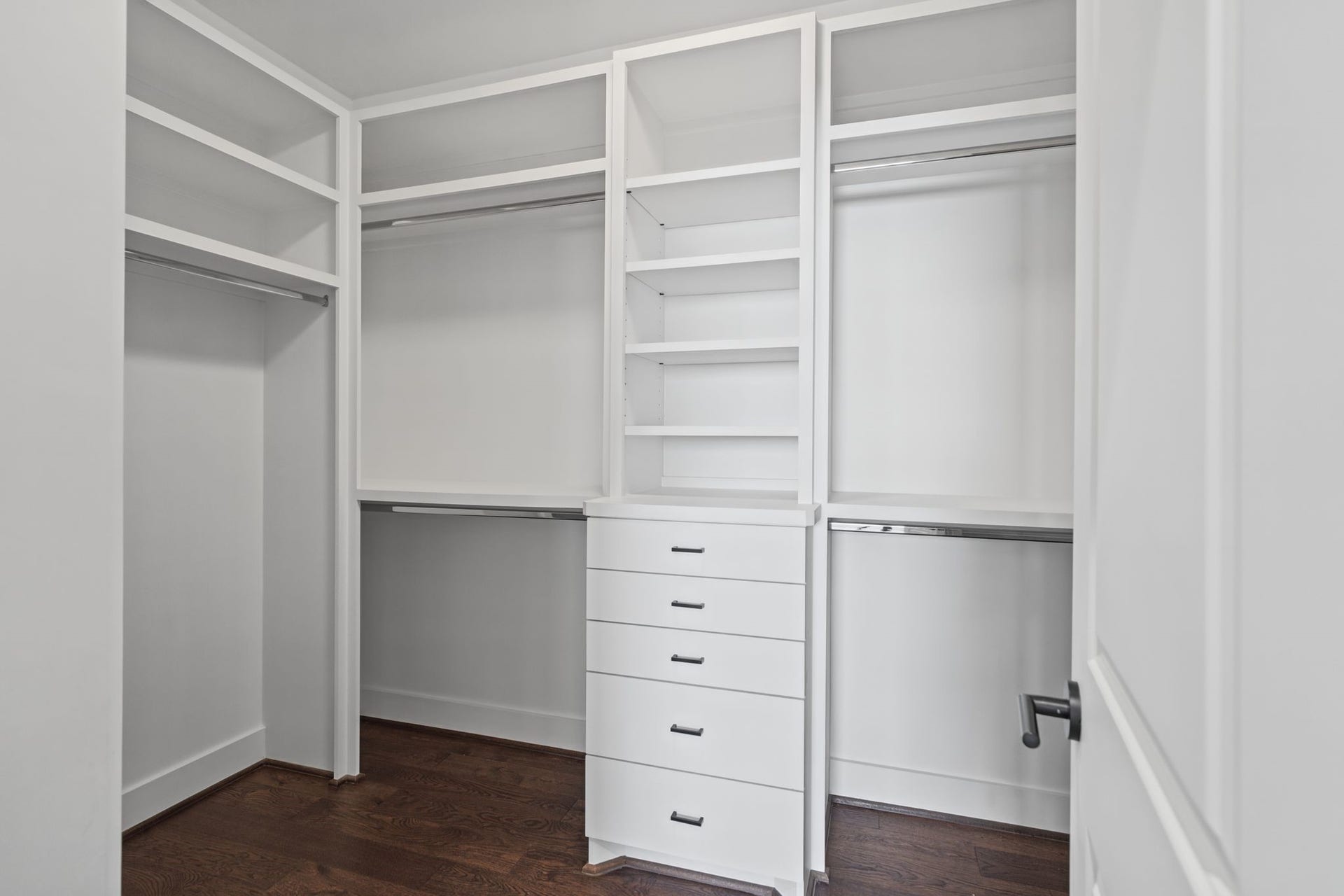 1538 Vermont Street, #A, Houston, TX 77006 Custom-style built-in organization with generous hanging space, shelving, and drawers offers an elegant, practical solution for wardrobe storage.