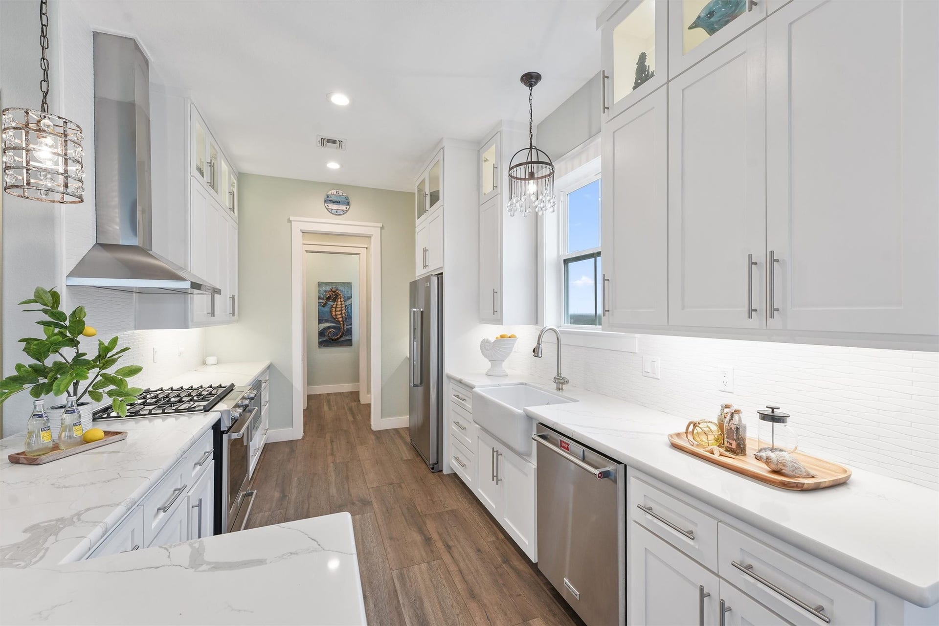 11418 Starfish Lane, Galveston, TX 77554 Additional highlights include a gas stove with a griddle