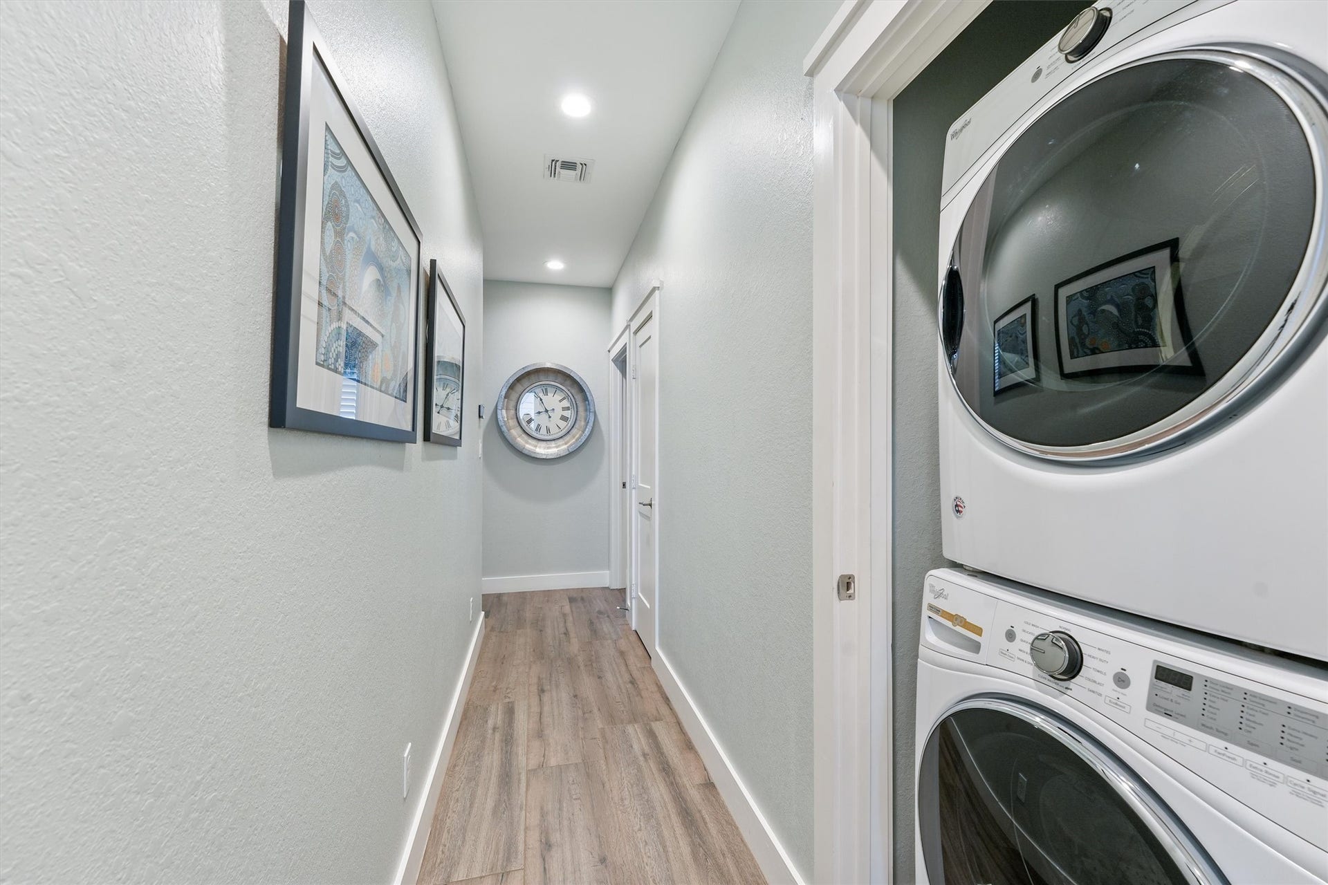 11418 Starfish Lane, Galveston, TX 77554 A second laundry area with stackable front-load appliances adds convenience.