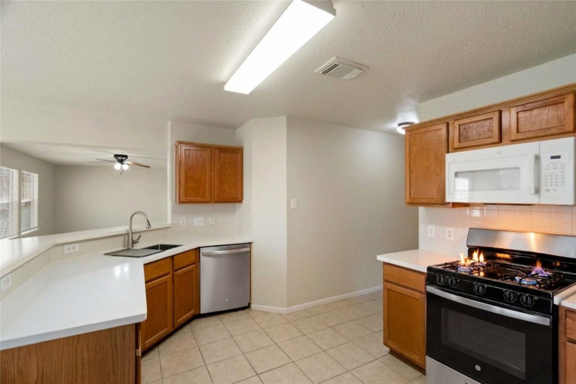 New Counter Tops, Dishwasher, Sink, and Range, accents the well laid out Kitchen