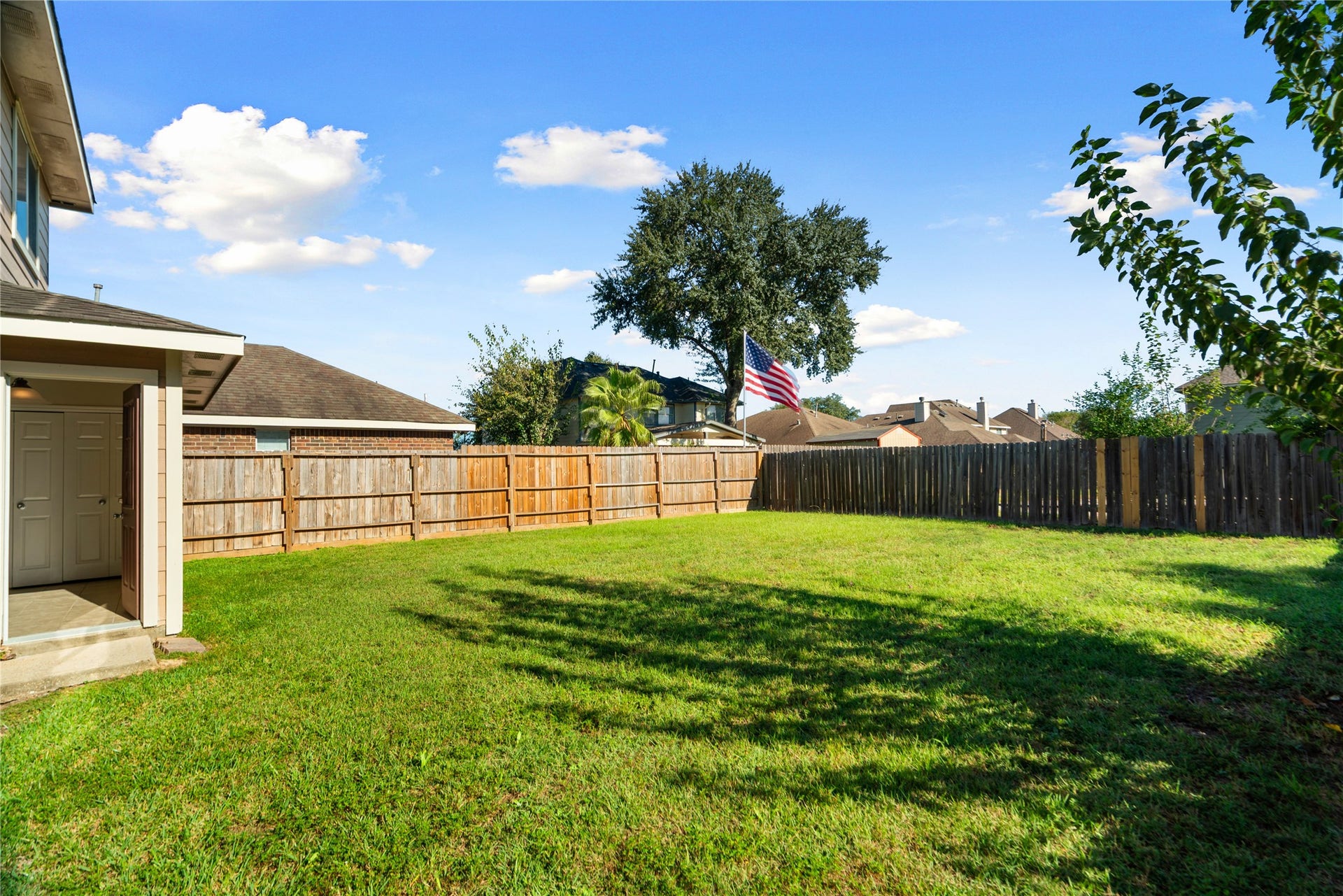 Spacious, fully fenced backyard perfect for outdoor activities and entertaining.