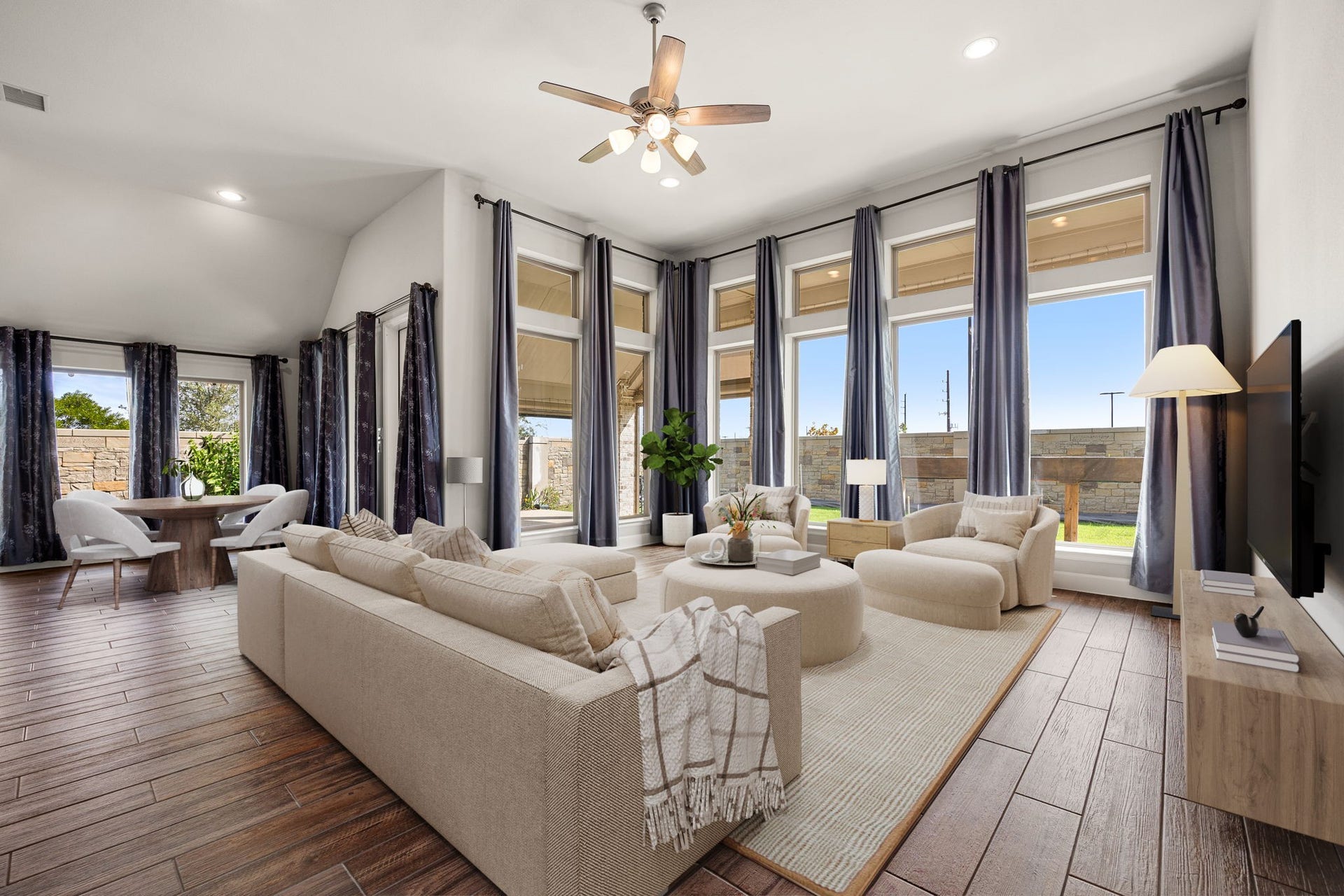 Designed with hosting in mind, this sprawling layout connects living, dining and kitchen spaces effortlessly. Whether you are gathering around the dinner table or lounging on the sofa, the continuous wood-look tile floors and sheer abundance of natural light create an environment that feels both grand and incredibly cozy. *Virtually Staged