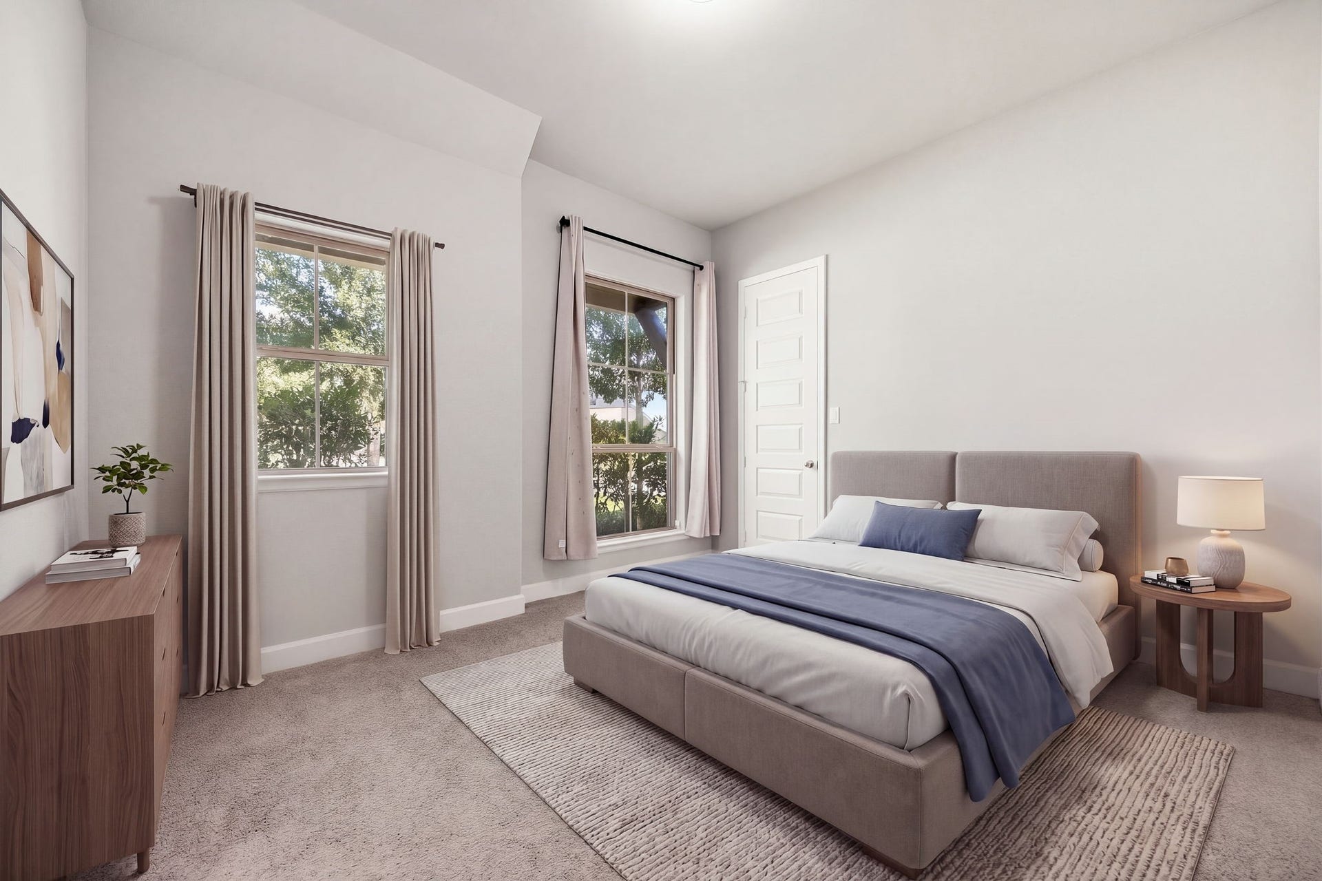Situated privately at the front of the home, this spacious secondary bedroom features high ceilings, plush carpeting, and dual oversized windows that look out over the front lawn, filling the space with warm, welcoming light. *Virtually Staged