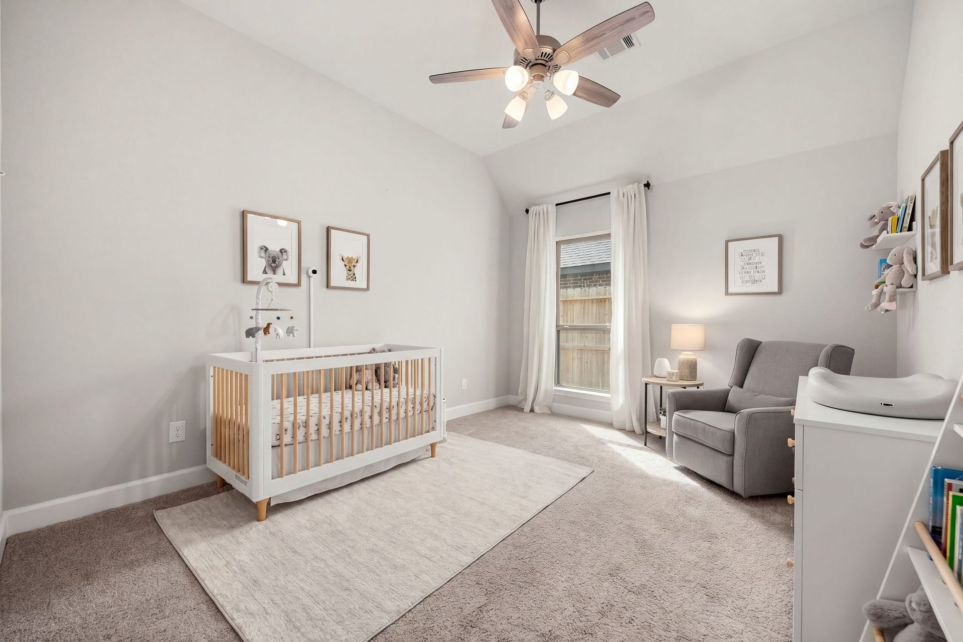 This spacious third secondary bedroom functions beautifully as a private guest suite or nursery. It boasts high sloped ceilings, plush carpeting, a multi-light ceiling fan, and the ultimate convenience of a private en-suite bathroom, offering visitors or family members a comfortable and independent space to unwind.