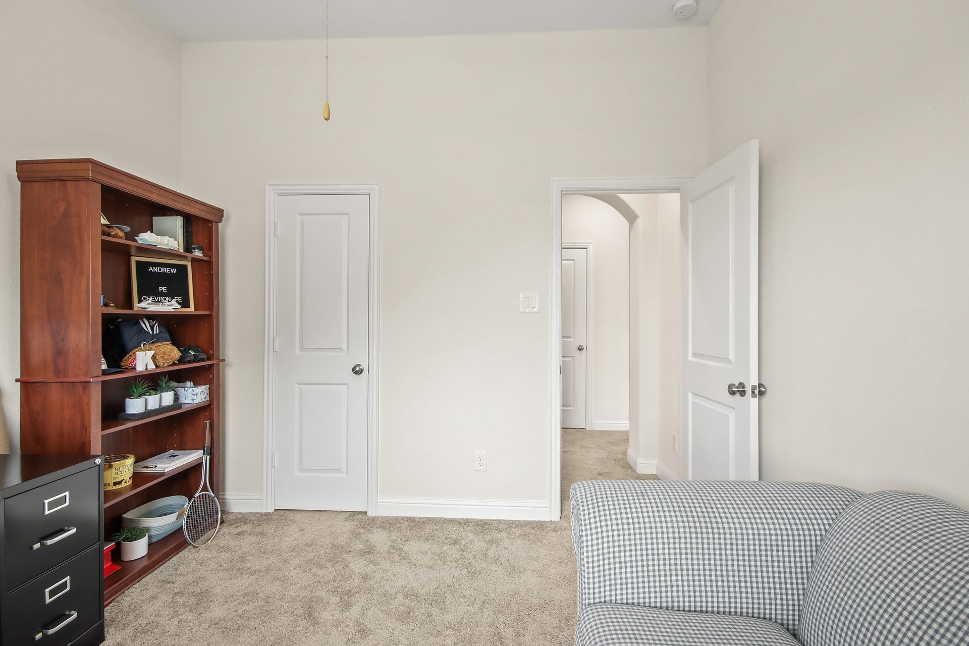 The secondary with walk in closet and bathroom just outside door.