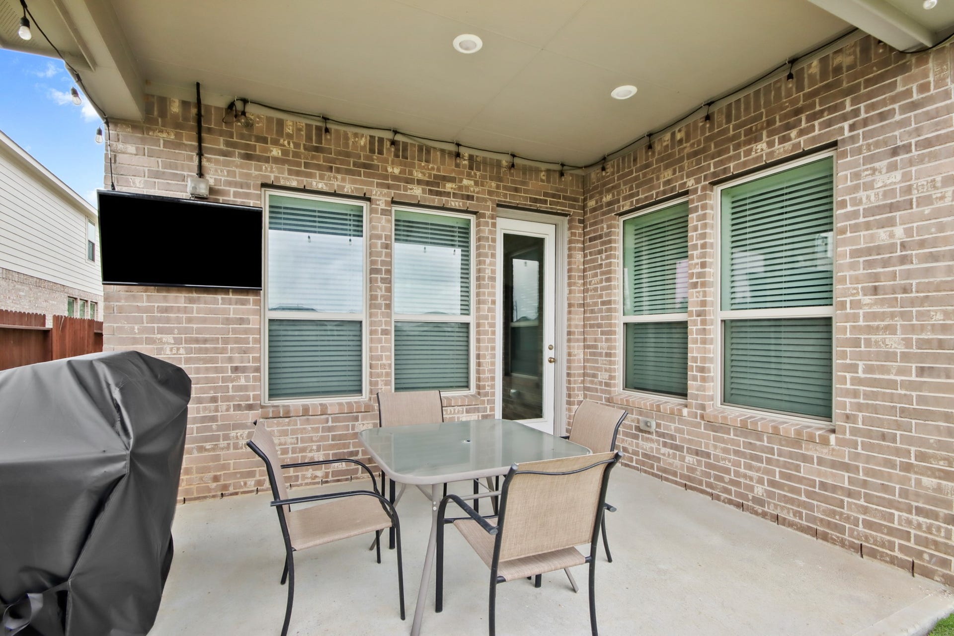 Outdoor patio off kitchen/family room with wiring for TV, gas stub and room for outdoor dining.