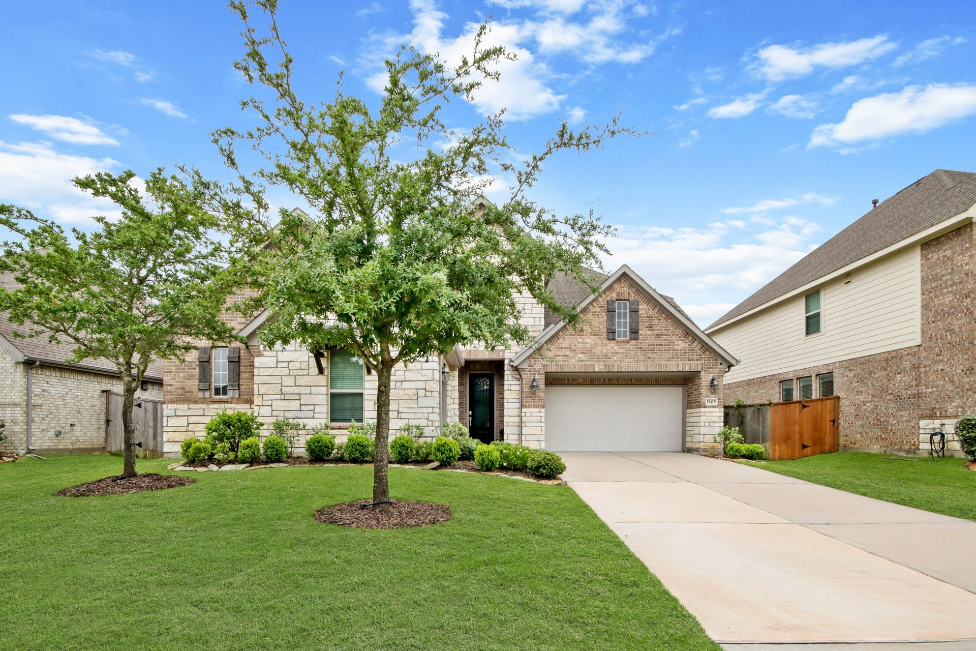 Lush landscape, full trees add to the curb appeal
