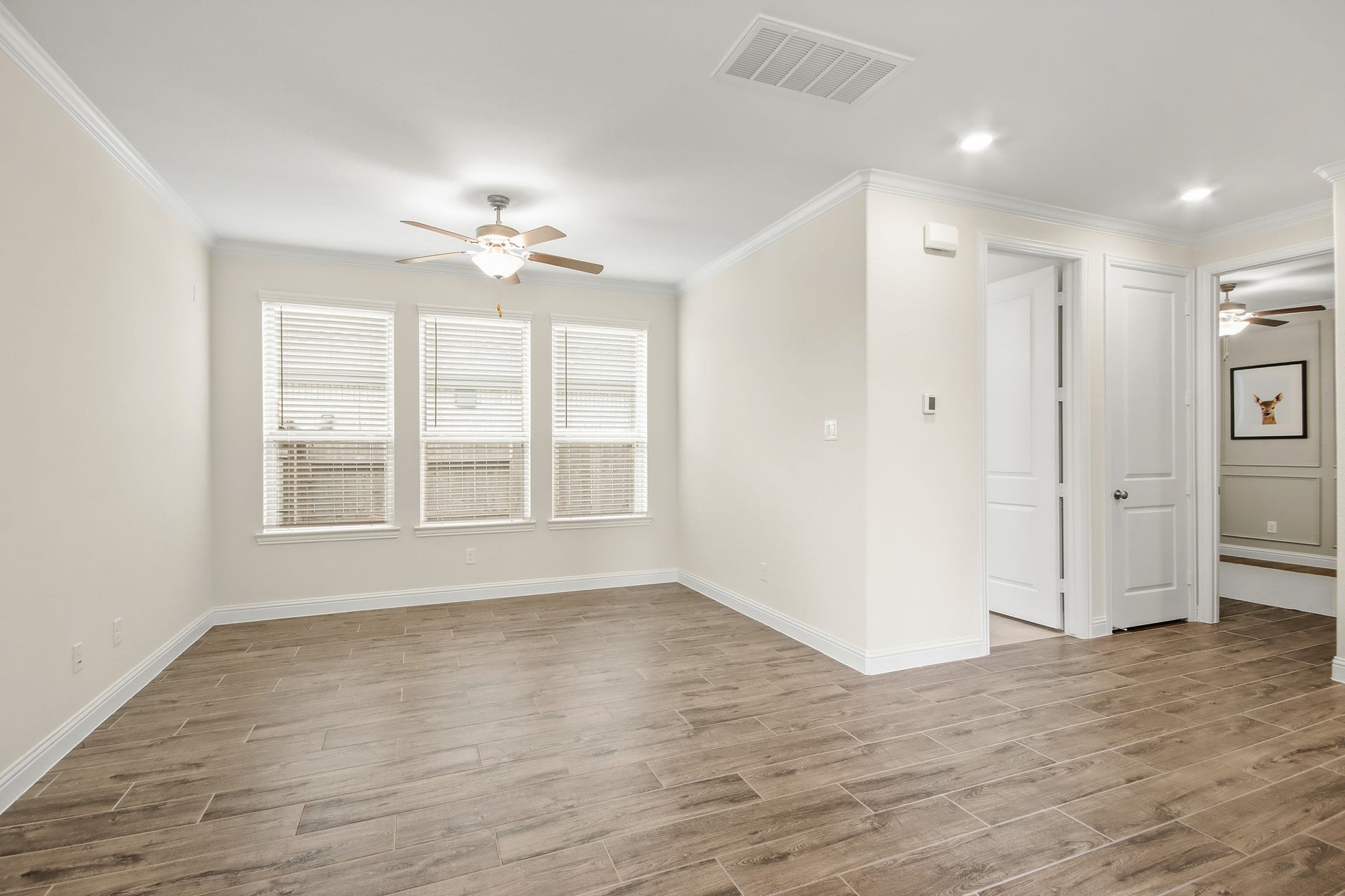 Next Gen has wall of windows lending tons of natural light. Family room also offers ceiling fan.