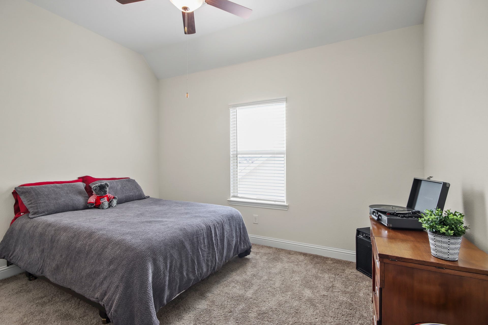 Another secondary bedroom with full size bed, dresser and plenty of extra space.