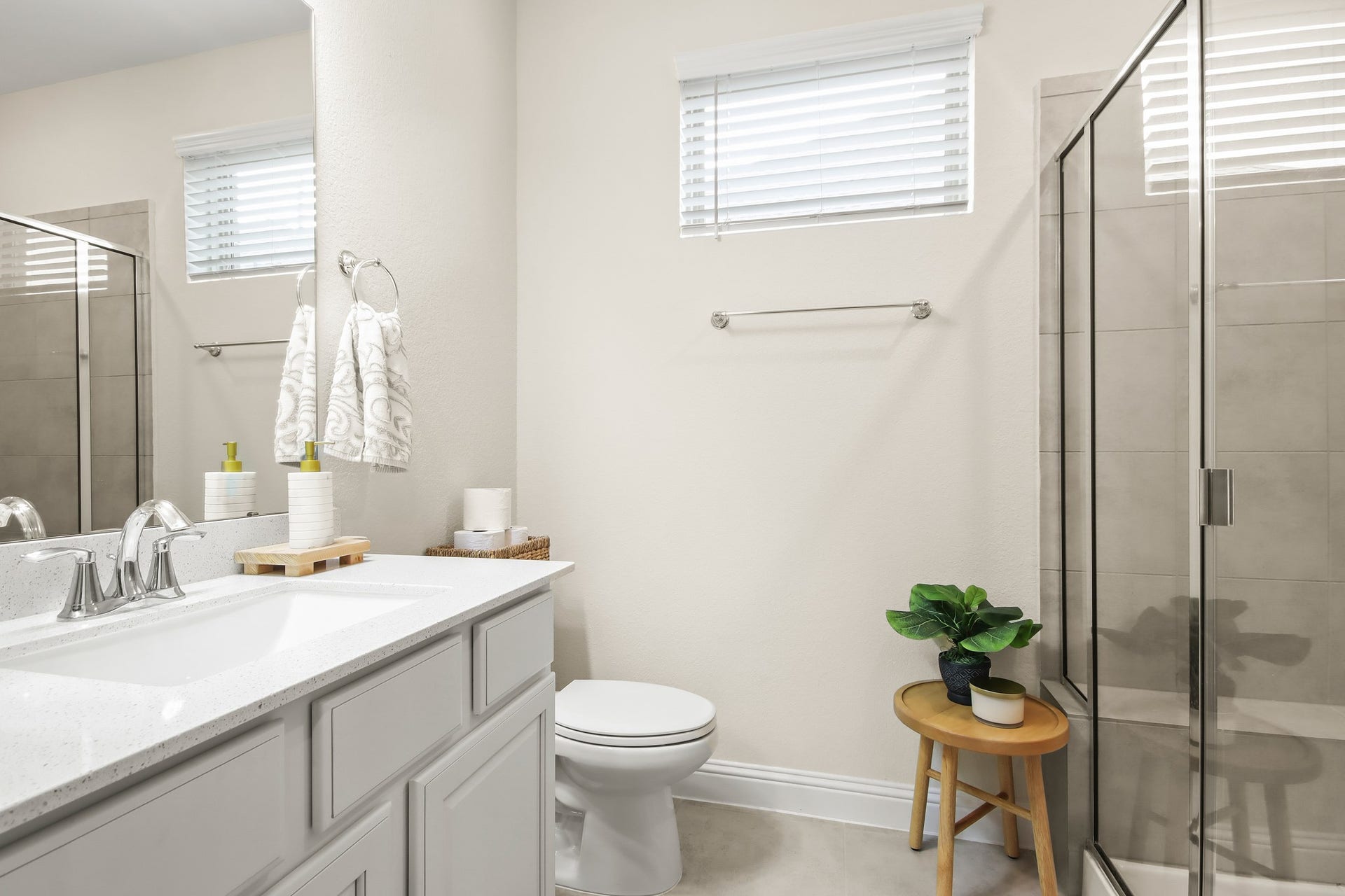Next Gen large bathroom with oversized shower, vanity with sink and upgraded cabinet.