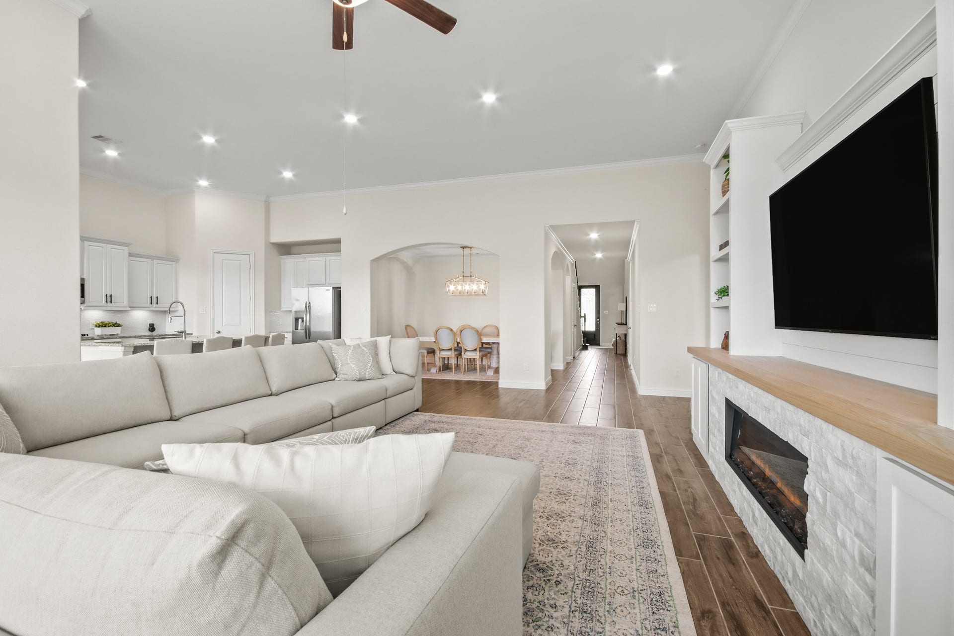 Desirable open floor plan, extra can lighting installed in family room.