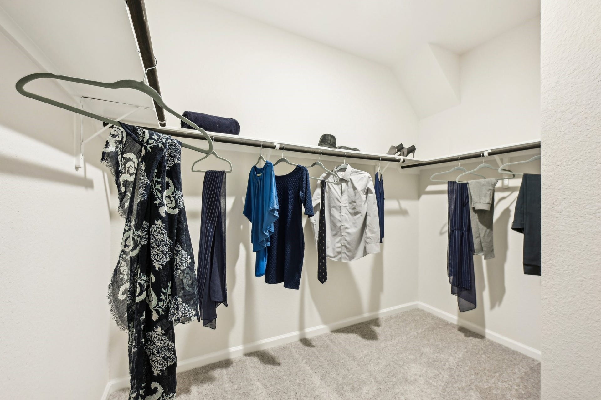 2831 Wind Cave Drive, Iowa Colony, TX 77583 Oakshire II- Primary Closet. Sample image for illustration; upgrades, options, and colors may vary.