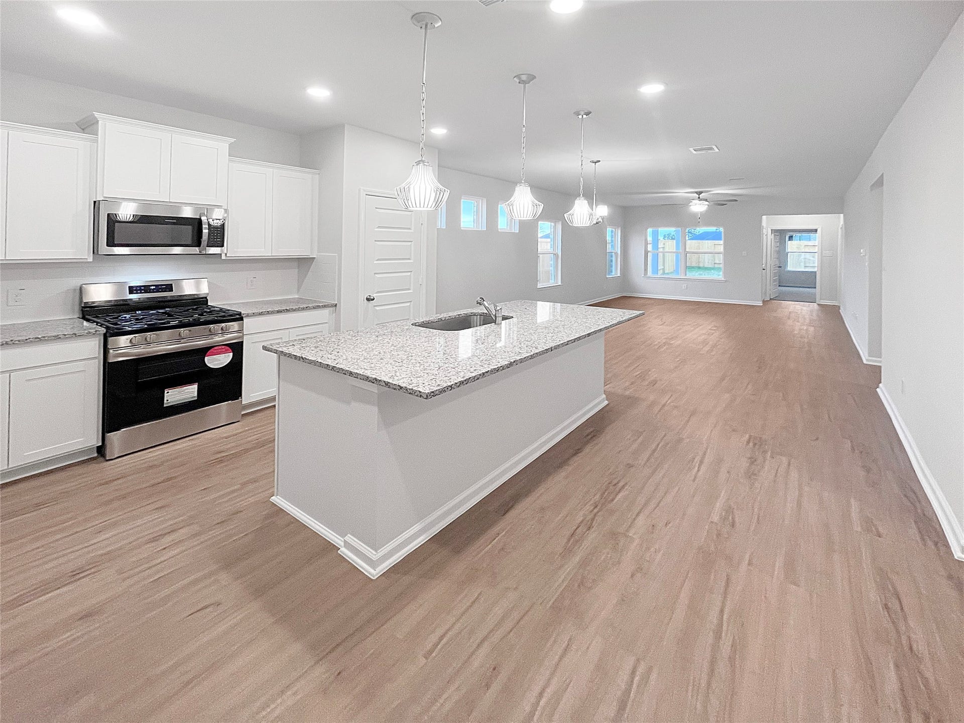 2831 Wind Cave Drive, Iowa Colony, TX 77583 Oakshire II- Kitchen. Sample image for illustration; upgrades, options, and colors may vary.
