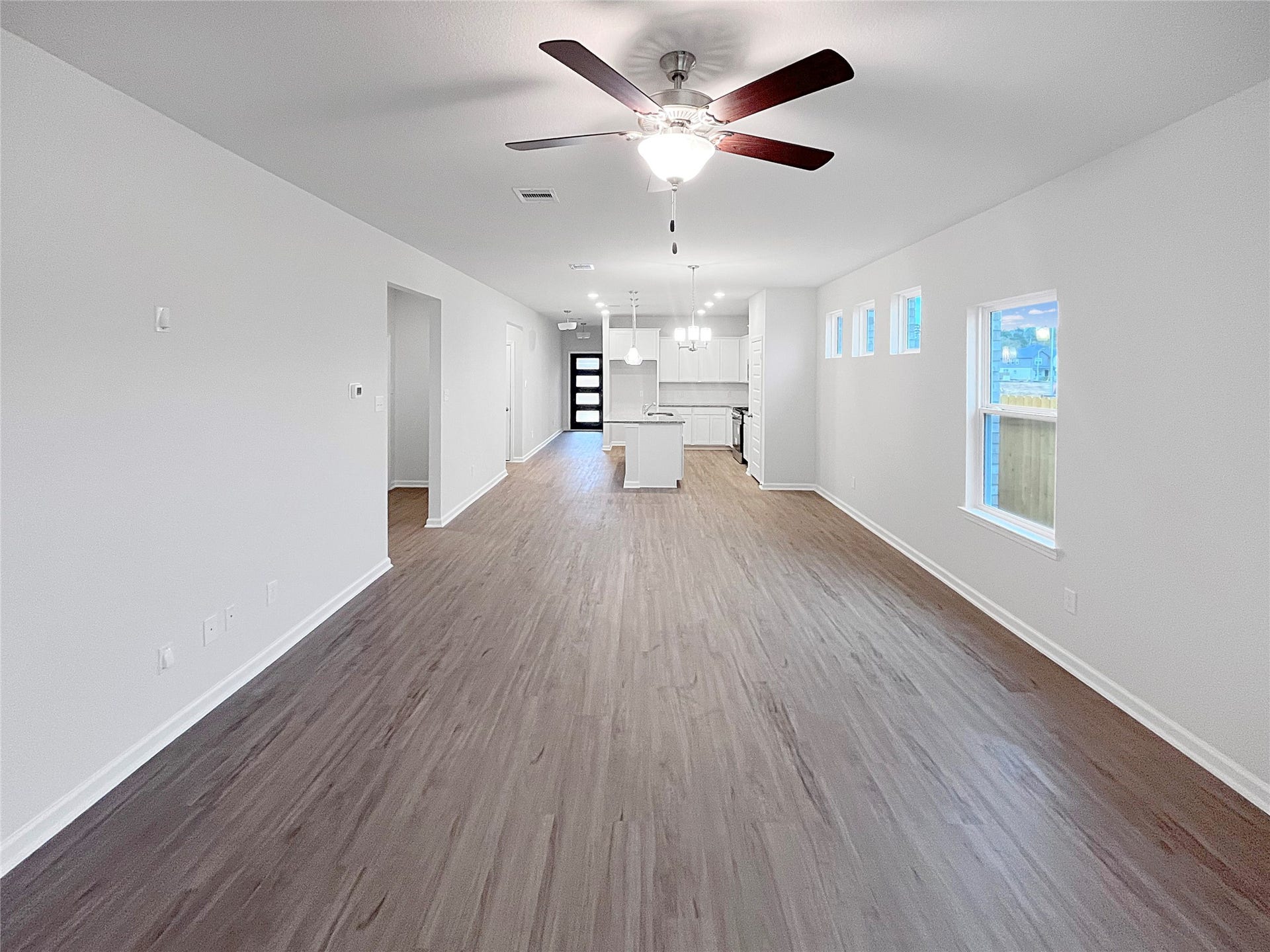 2831 Wind Cave Drive, Iowa Colony, TX 77583 Oakshire II- Family Room. Sample image for illustration; upgrades, options, and colors may vary.