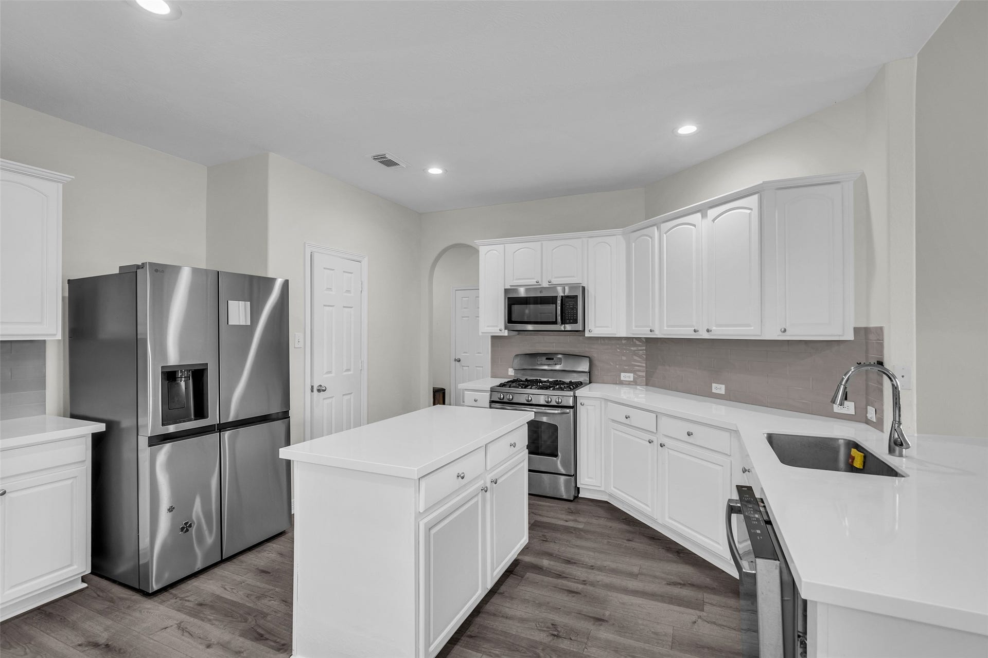island kitchen that open up to the living room