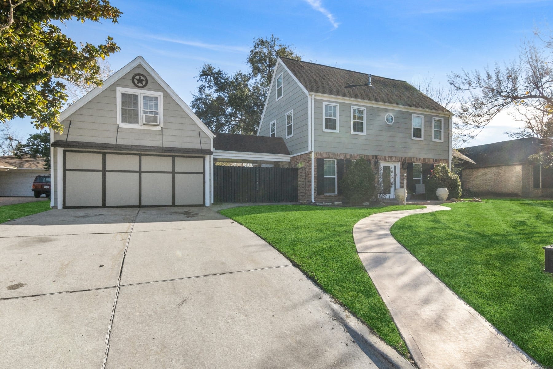 5443 Appleblossom Lane, Friendswood, TX 77546 Double wide extended driveway with walk way to the house.