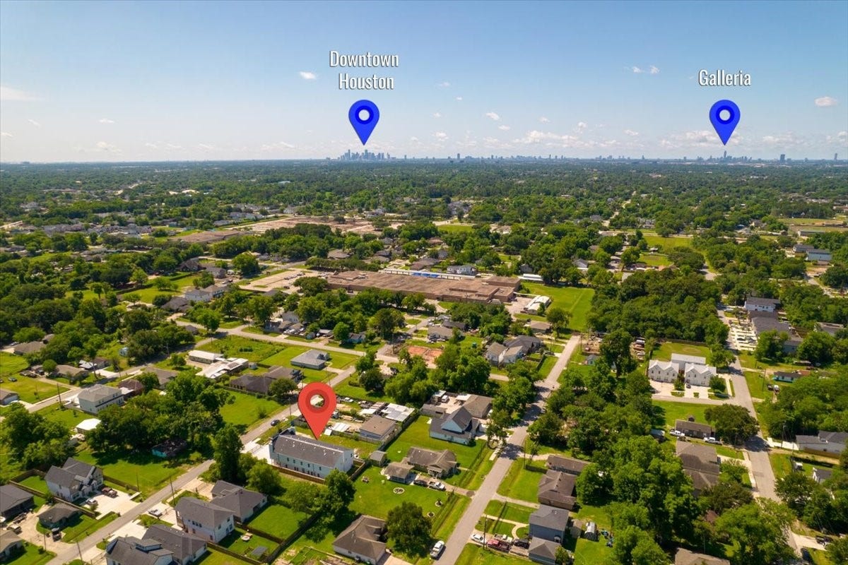 8323 Observatory Street, #A/B, Houston, TX 77088 The drone perspective highlights the duplexs prime location, surrounding development, and easy access to major Houston thoroughfares.