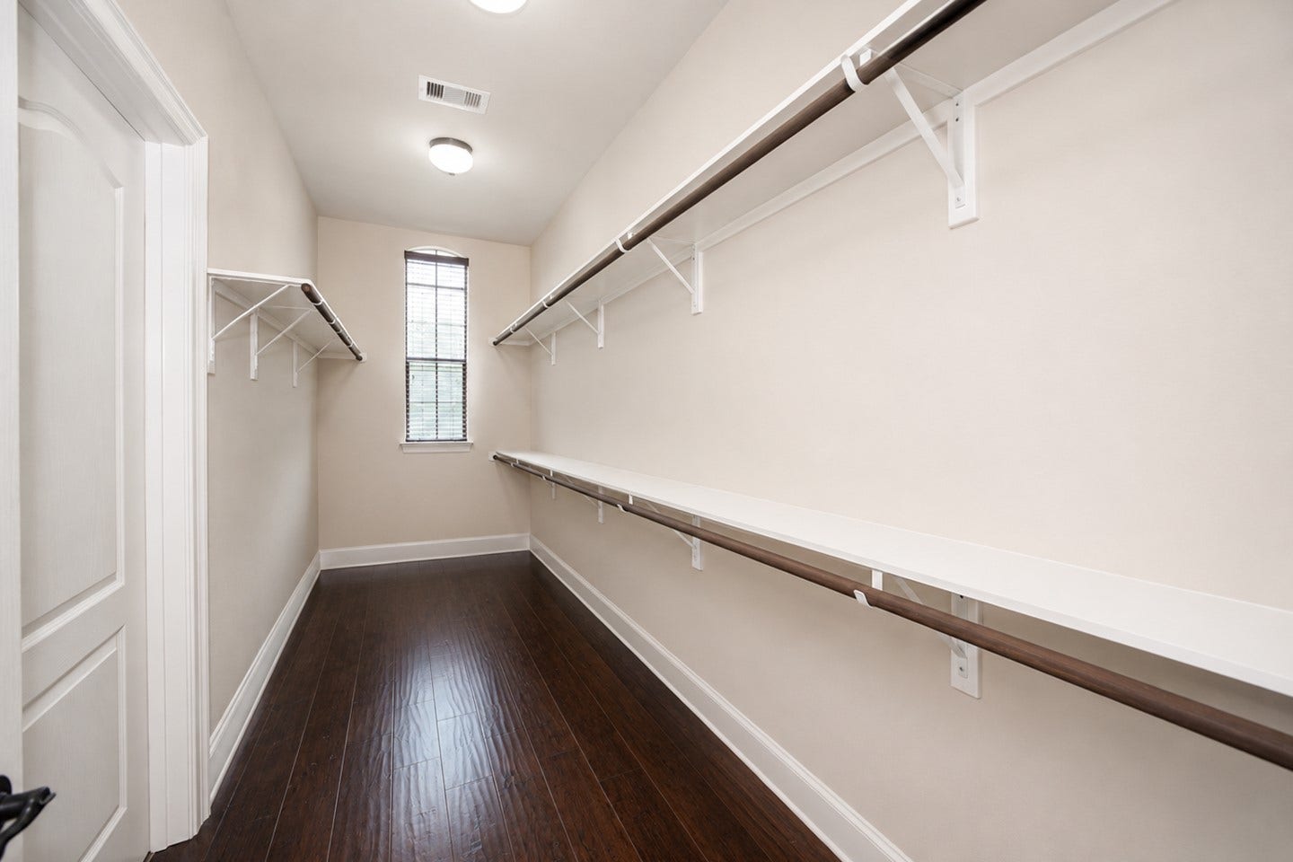6323 Orange Blossom Lane, Rosenberg, TX 77471 Primary closet - Virtually enhanced image. Personal items have been removed to demonstrate the closets full storage potential.
