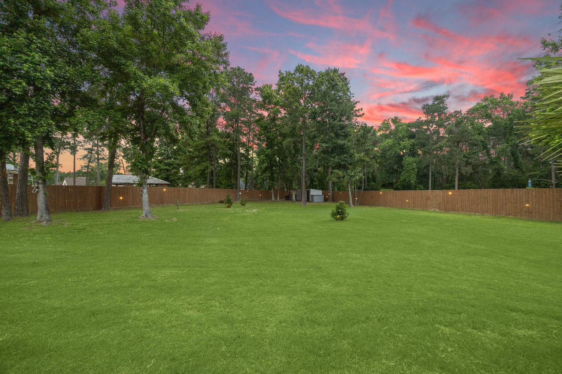 27303 E Benders Landing Boulevard, Spring, TX 77386 Expansive backyard offers plenty of space for outdoor activities, sports, play or gardening. All surrounded by mature trees included for added privacy and natural beauty. Peach tree Chinese Magnolia trees, in front and backyard landscape.