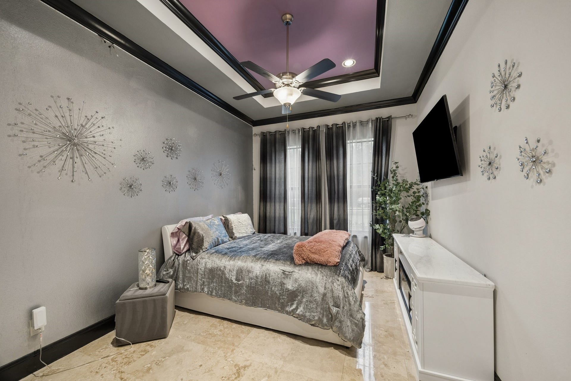 27303 E Benders Landing Boulevard, Spring, TX 77386 One of the secondary bedrooms featuring an ensuite bathroom, tray ceiling with accent details, ceiling fan, a large window that provides natural light.