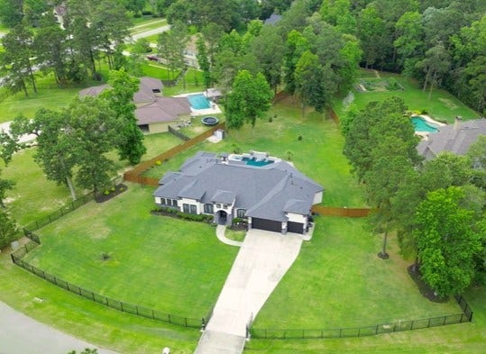 27303 E Benders Landing Boulevard, Spring, TX 77386 Set on an expansive homesite surrounded by mature trees and distinguished neighboring estates, this exceptional property offers a striking blend of luxury and privacy. The extended driveway, spacious grounds and thoughtfully designed layout creates and impressive setting with room to relax, entertain and enjoy everyday living.