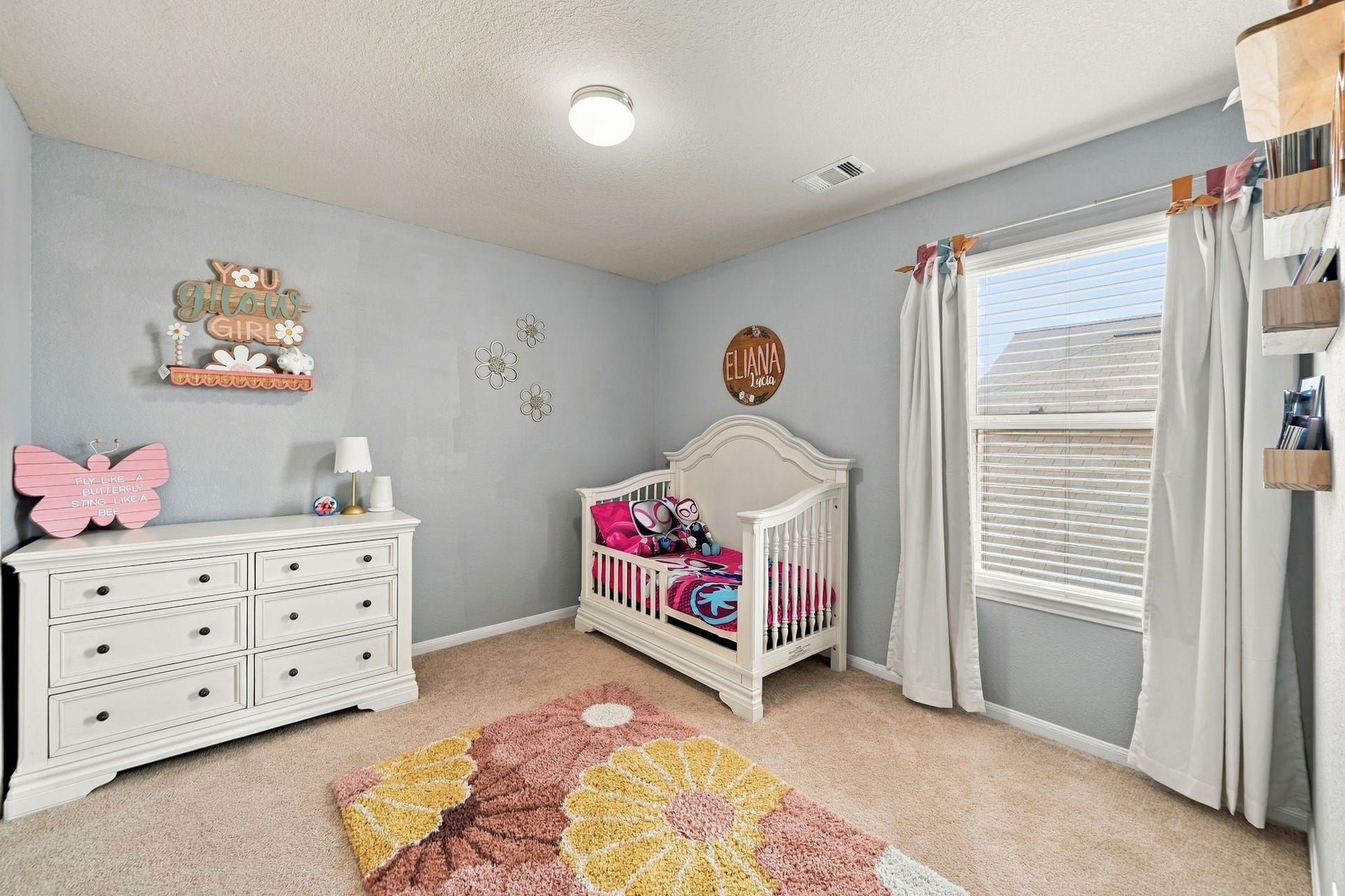 Secondary Bedroom: Comfortable secondary bedroom offers a large window, neutral finishes and flexible furniture placement.