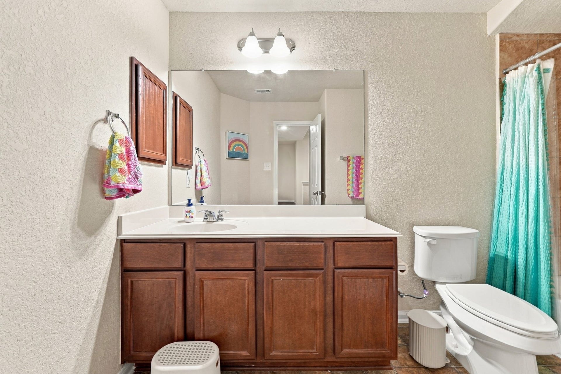 Full Bathroom: Full secondary bath features a generous vanity, large mirror and tub/shower combination.