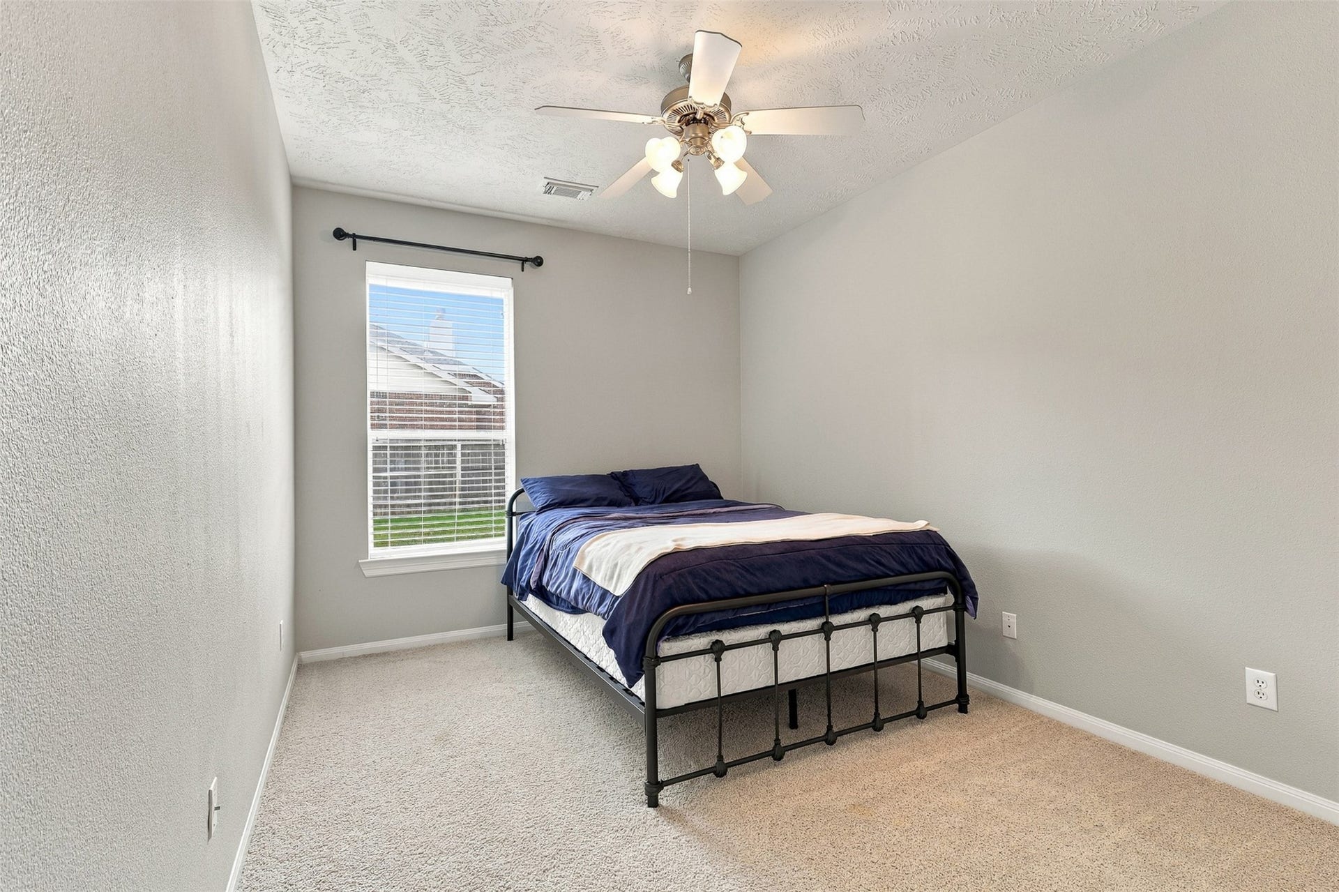 6522 Pine Reserve Drive, Spring, TX 77389 Cozy secondary bedroom with soft carpeting and ample natural light.
