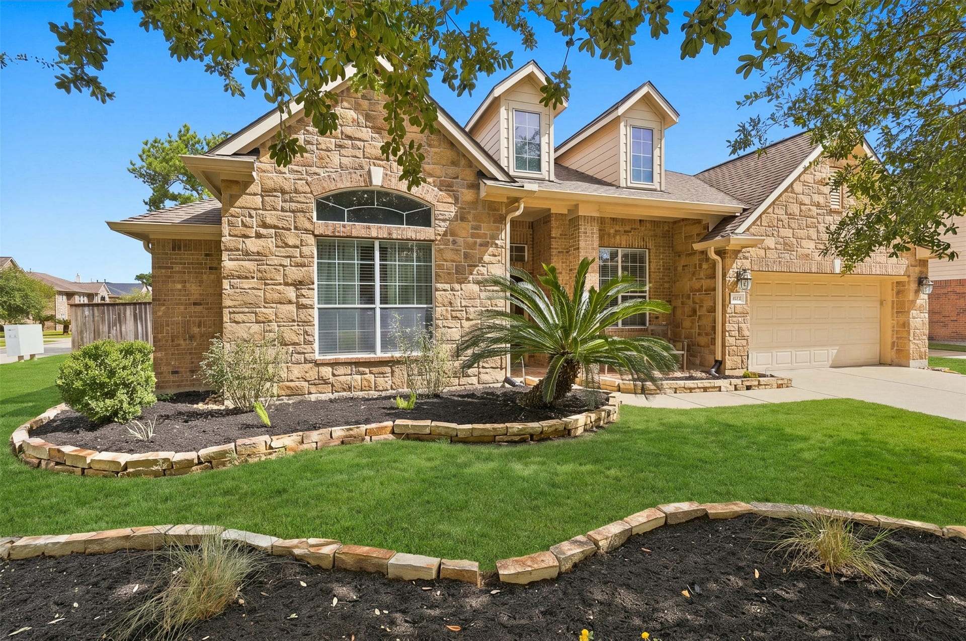 6522 Pine Reserve Drive, Spring, TX 77389 Stunning stone facade with manicured landscaping and inviting entryway.