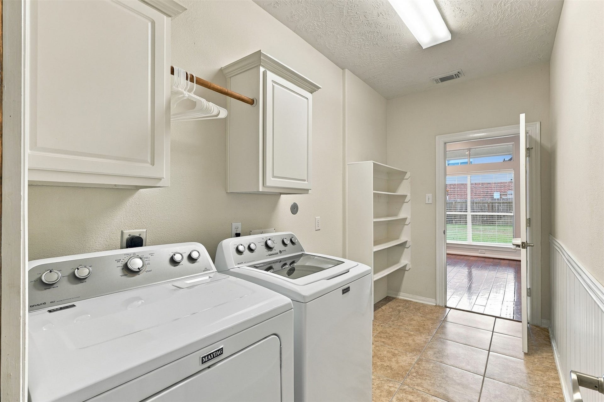 6522 Pine Reserve Drive, Spring, TX 77389 Spacious laundry room with ample storage and natural light, perfect for all your needs.