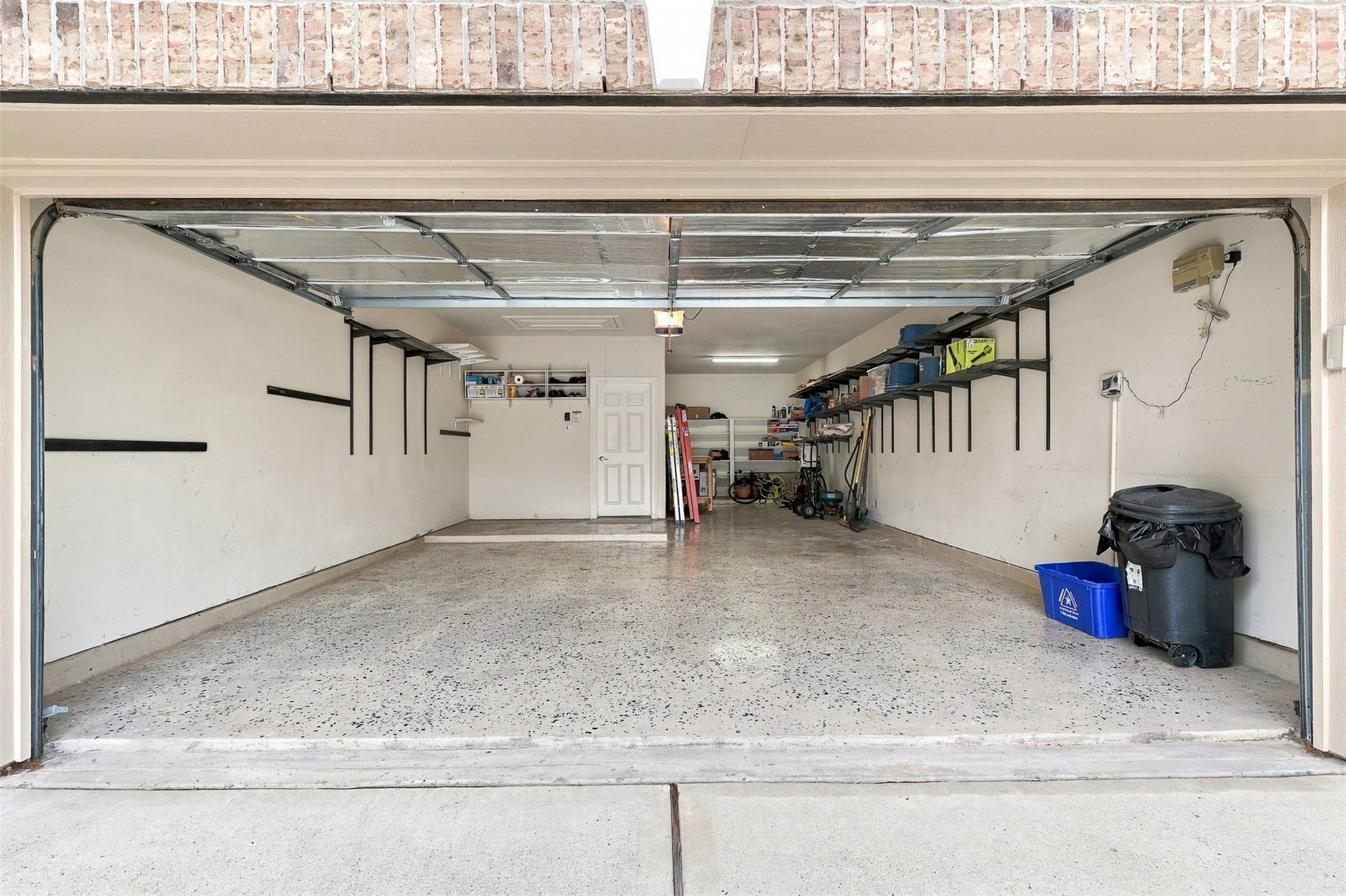 6522 Pine Reserve Drive, Spring, TX 77389 Expansive three-car garage featuring durable epoxy flooring.