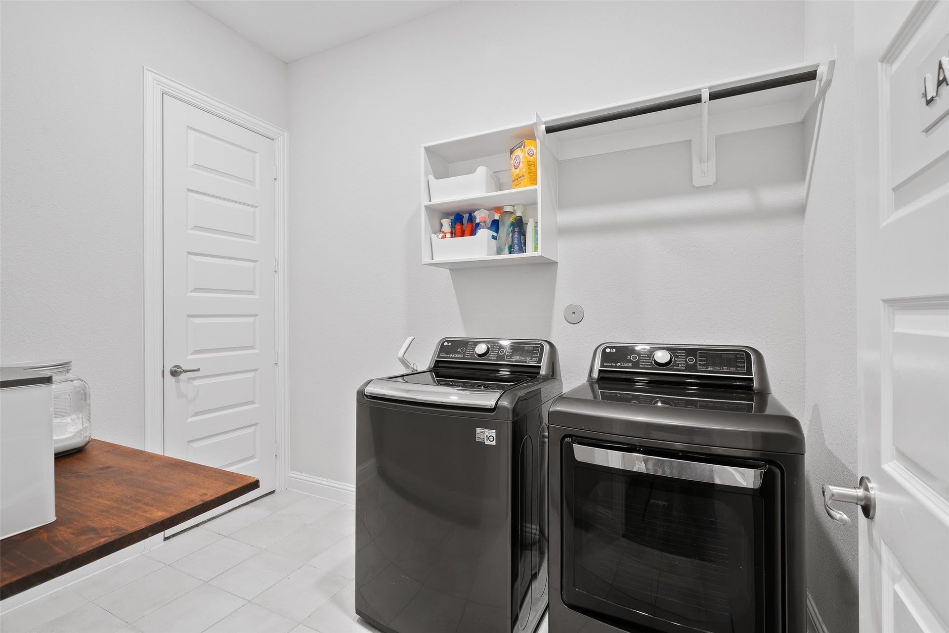 Across from the mud area is a large utility/laundry room that connects to the owner's suite walk-in closet and the mud room. Electric outlet for dryer.