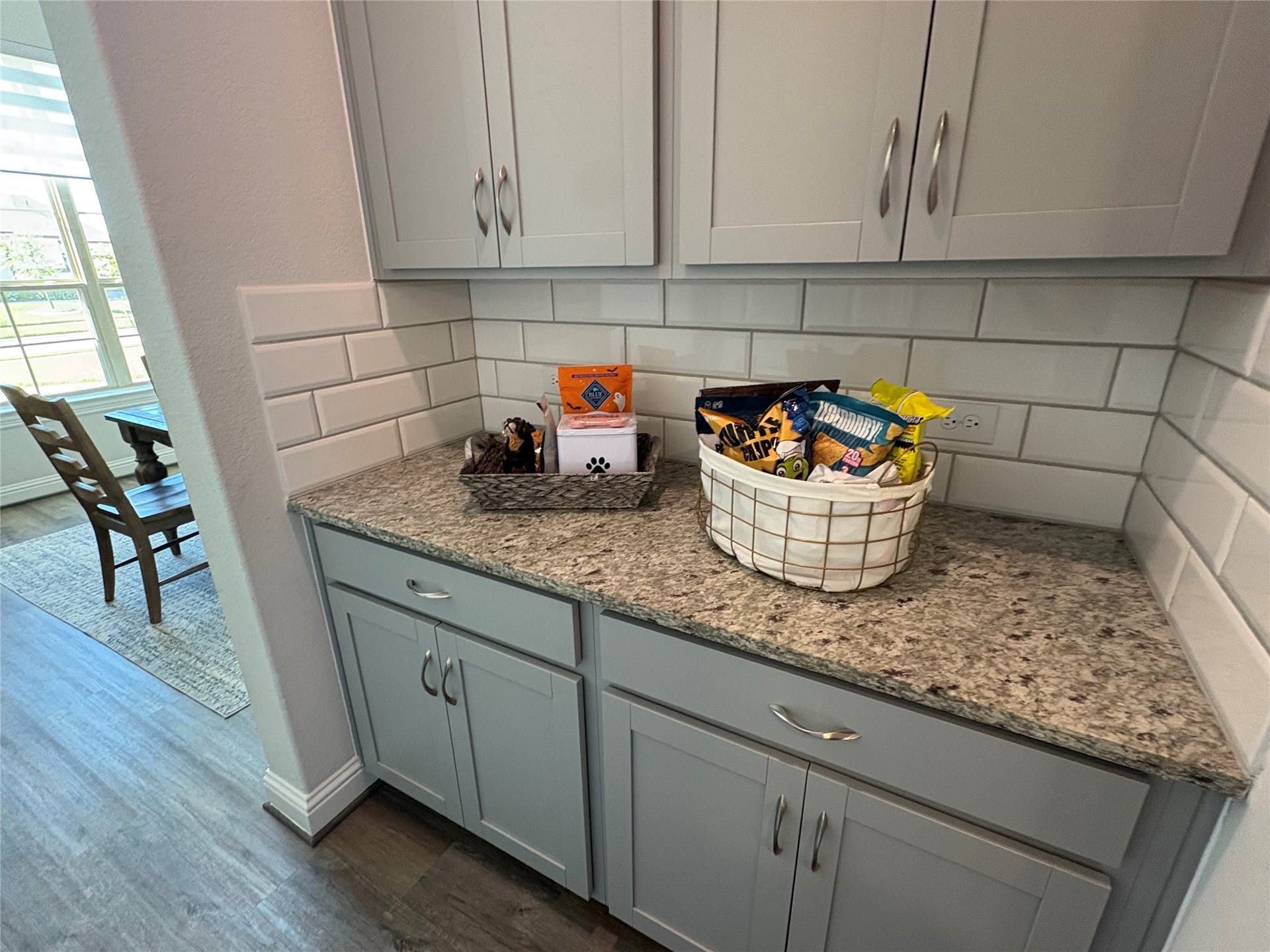 The butler's pantry is between the formal dining area and the kitchen.  It's ideal as a beverage station, coffee bar, or additional serving and storage.