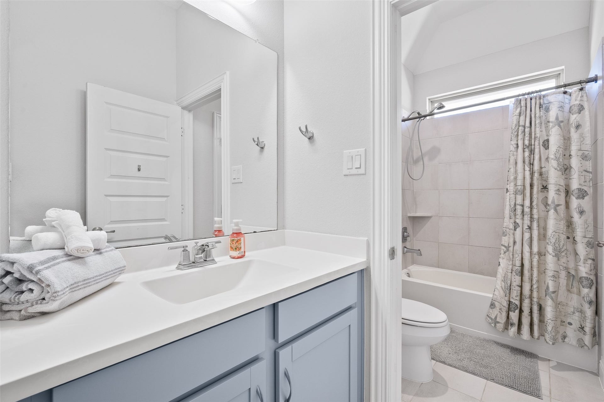 Bedroom 4 on second floor with a private separate sink, lots of storage, and a walk-in closet.  Jack and Jill style shared combo tub shower.