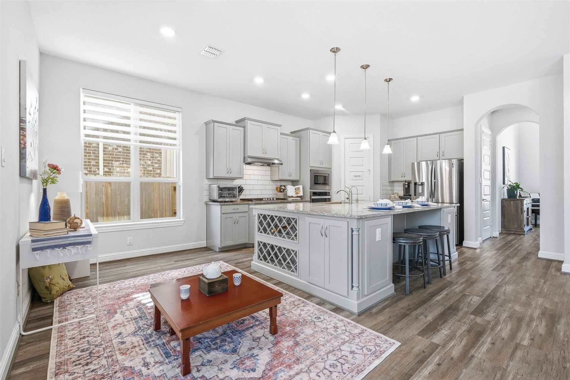 A bright breakfast area just off the kitchen offers a welcoming spot for casual meals, morning coffee, and relaxed gatherings with family and friends.