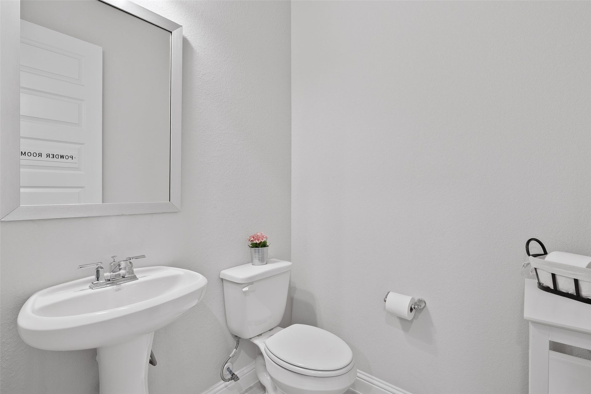 A half bath on the first floor is just outside the media room.