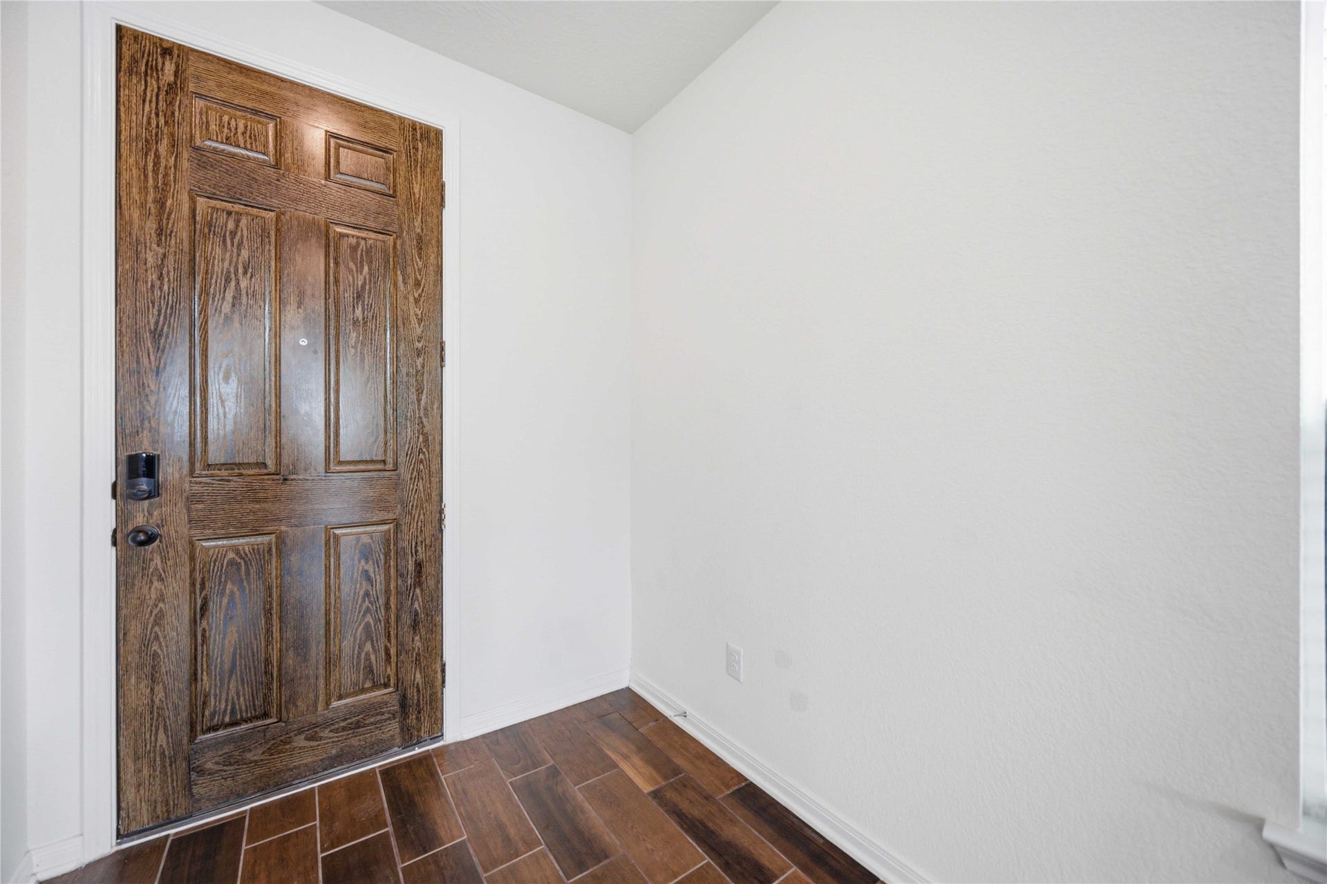 2111 Katalonia Lane, Fresno, TX 77545 Wood door with wood entry floors.