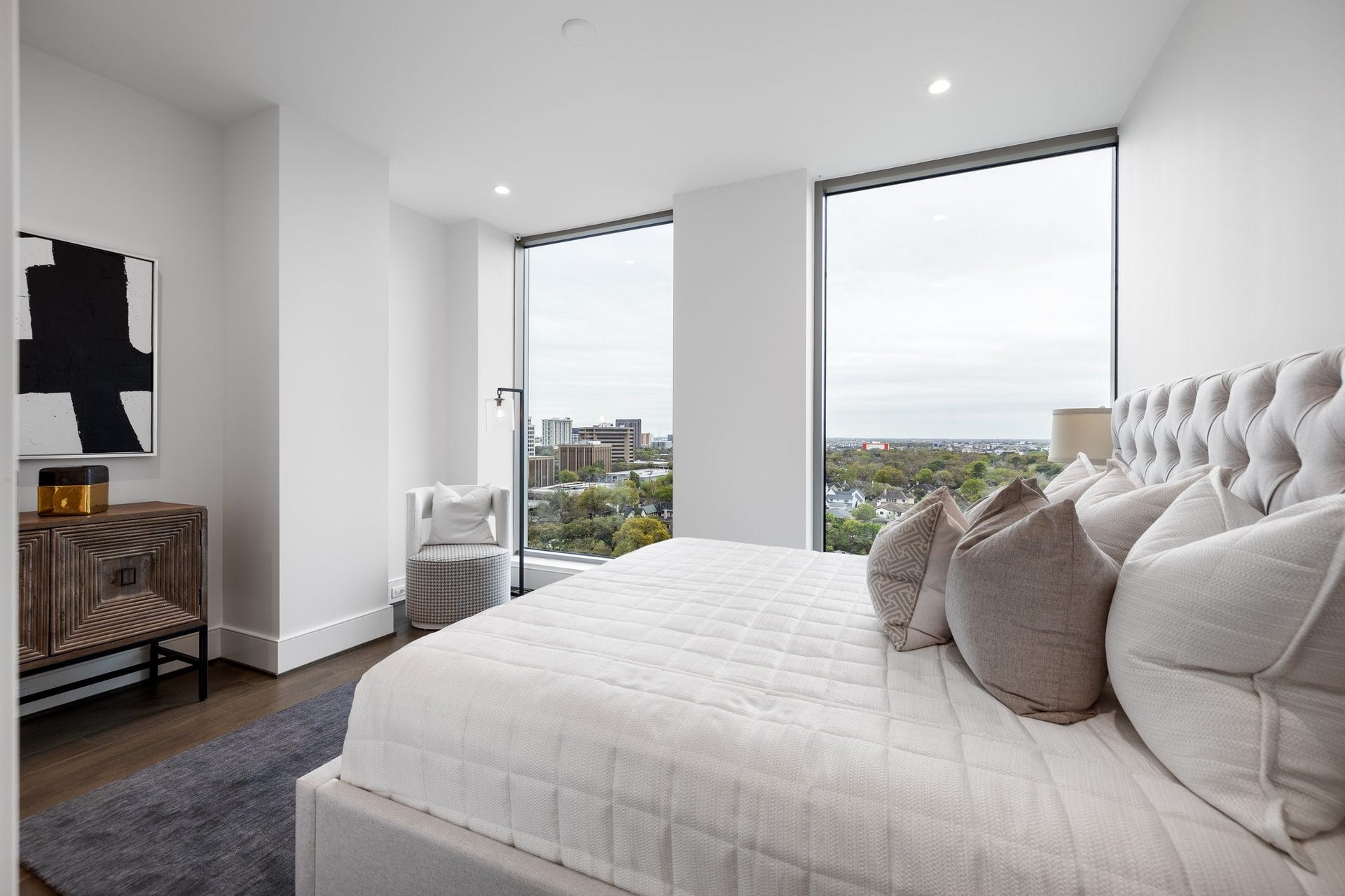5656 San Felipe Street, #1403, Houston, TX 77056 Primary bedroom with floor to ceiling windows. Photos are of a similar unit with the same floor plan