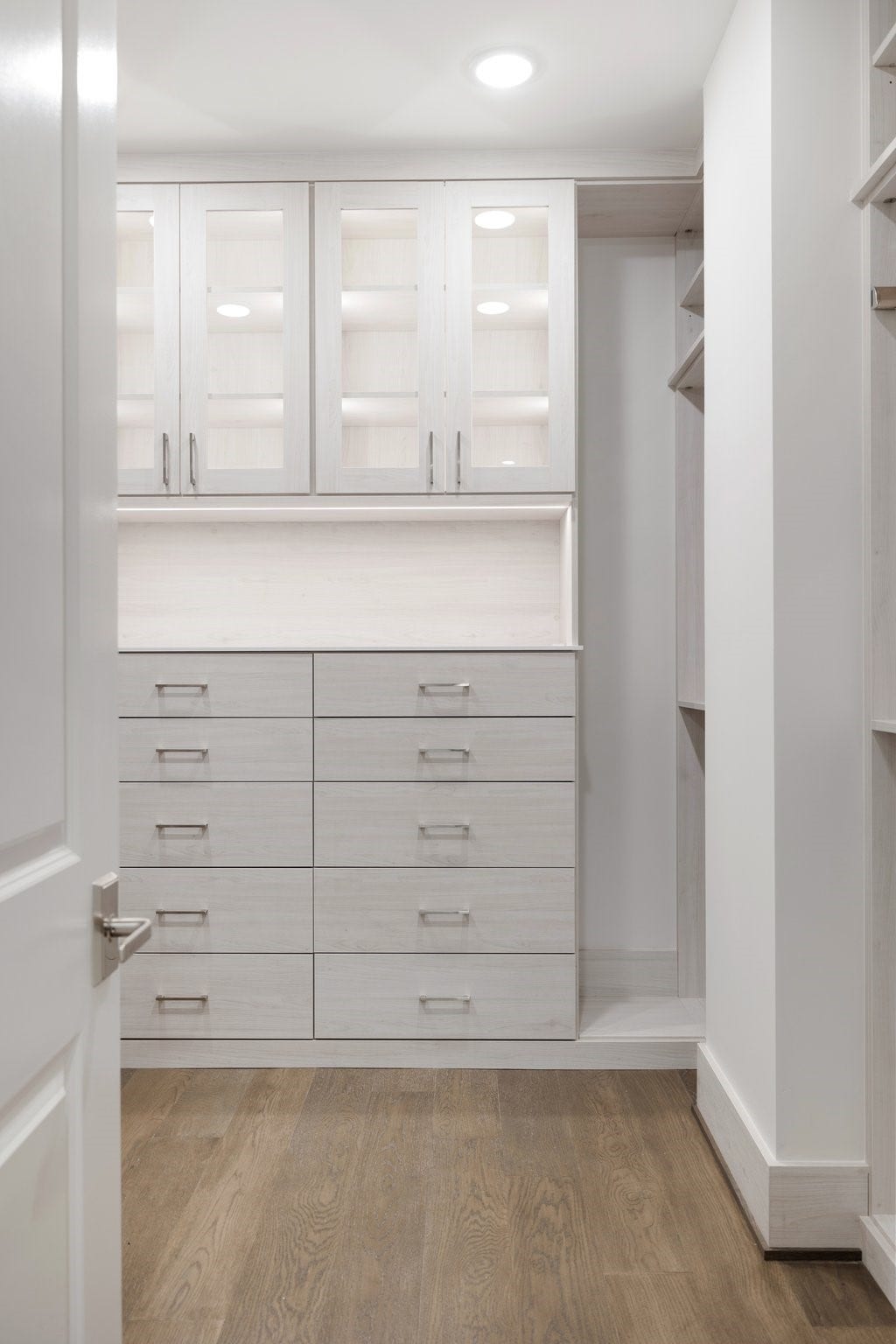 5656 San Felipe Street, #1403, Houston, TX 77056 Built-in glass cabinetry and drawers. Photos are of a similar unit with the same floor plan