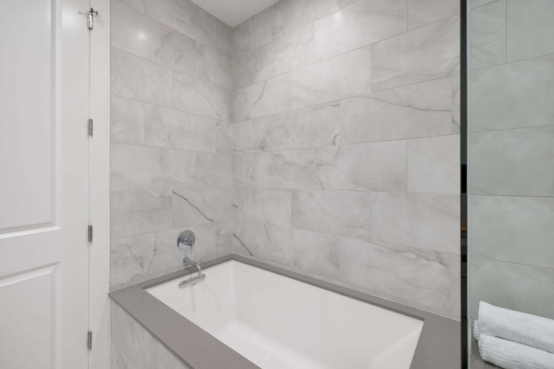 5656 San Felipe Street, #1403, Houston, TX 77056 Separate tub in primary bathroom. Photos are of a similar unit with the same floor plan