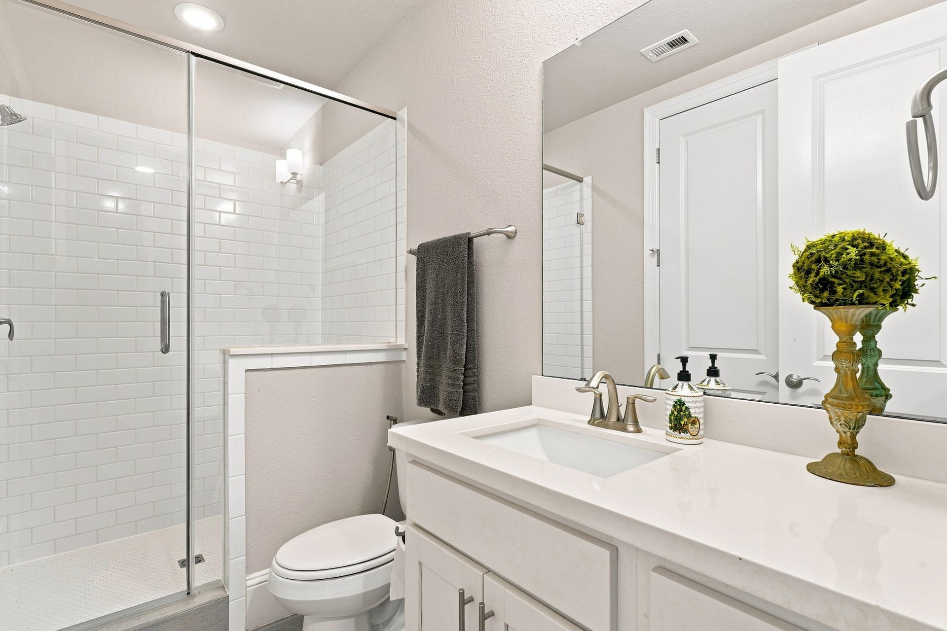 183 Grace Point Drive, Sugar Land, TX 77498 First floor full bathroom with glass shower doors and subway tiles in shower.