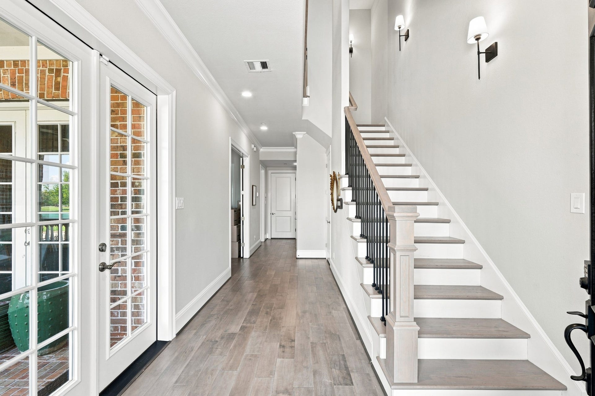 183 Grace Point Drive, Sugar Land, TX 77498 Rich Wood Flooring as you enter the home, French doors to the Balcony