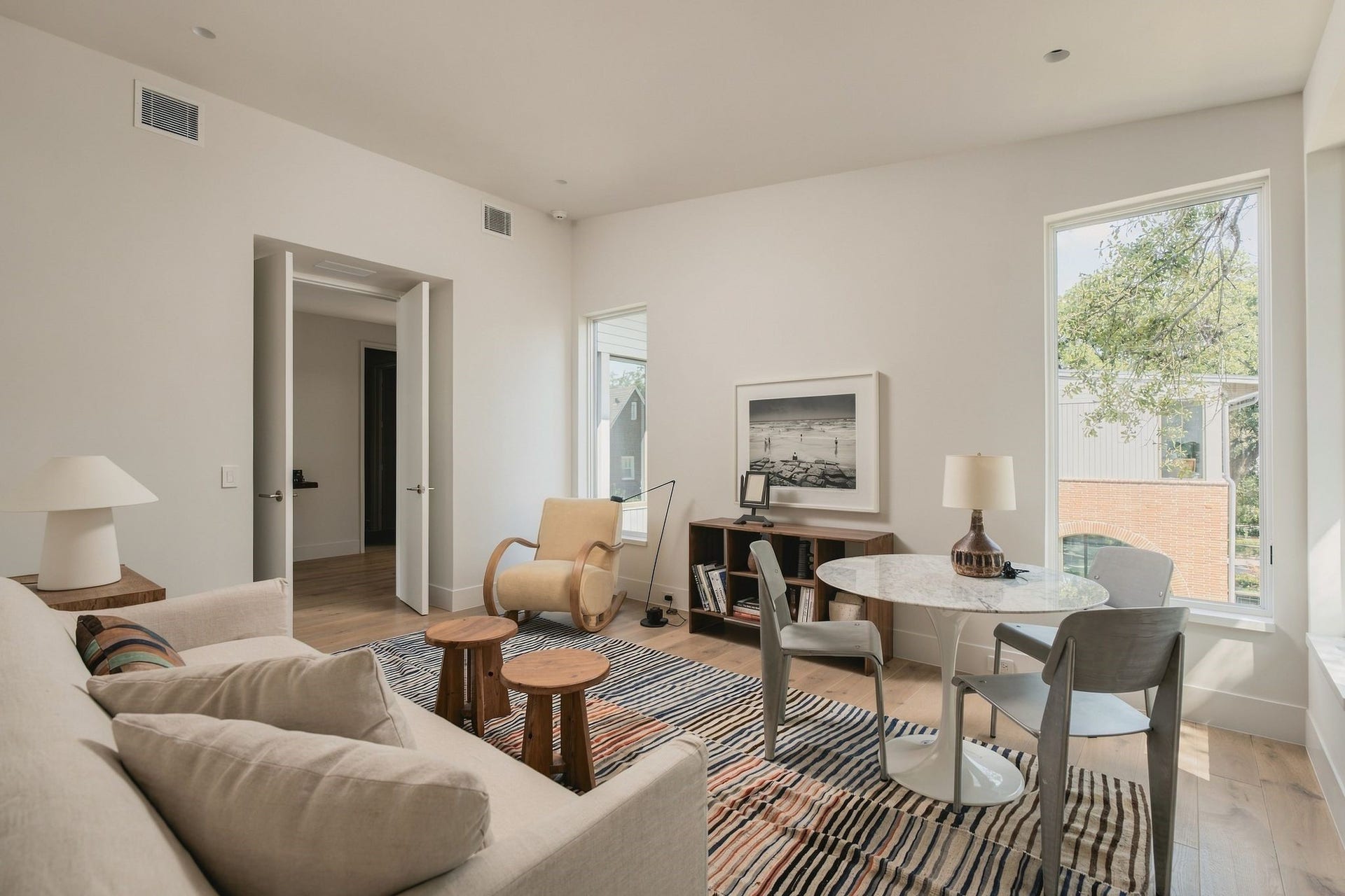 Large windows overlooking the backyard fill this versatile upstairs flex space w/natural light. French doors allow the room to remain connected or completely private, while a built-in desk adds everyday functionality for a home office, homework area or creative space.