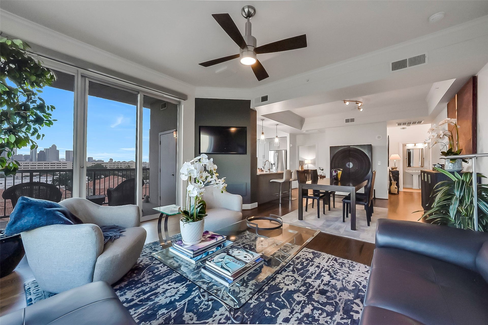 3333 Allen Parkway, #710, Houston, TX 77019 Living and dining area connect seamlessly with the kitchen, creating one expansive entertaining space, ideally suited for welcoming friends.