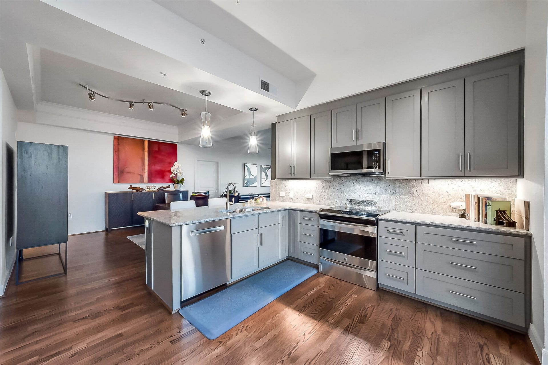 3333 Allen Parkway, #710, Houston, TX 77019 The redesigned kitchen features soft-close drawers and pull-out storage in the pantry area, adding to the chef's convenience.