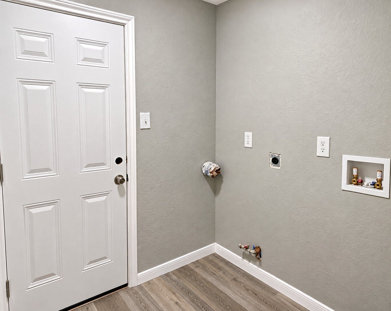 Inside Laundry Room with extra room for a laundry table or maybe a freezer.