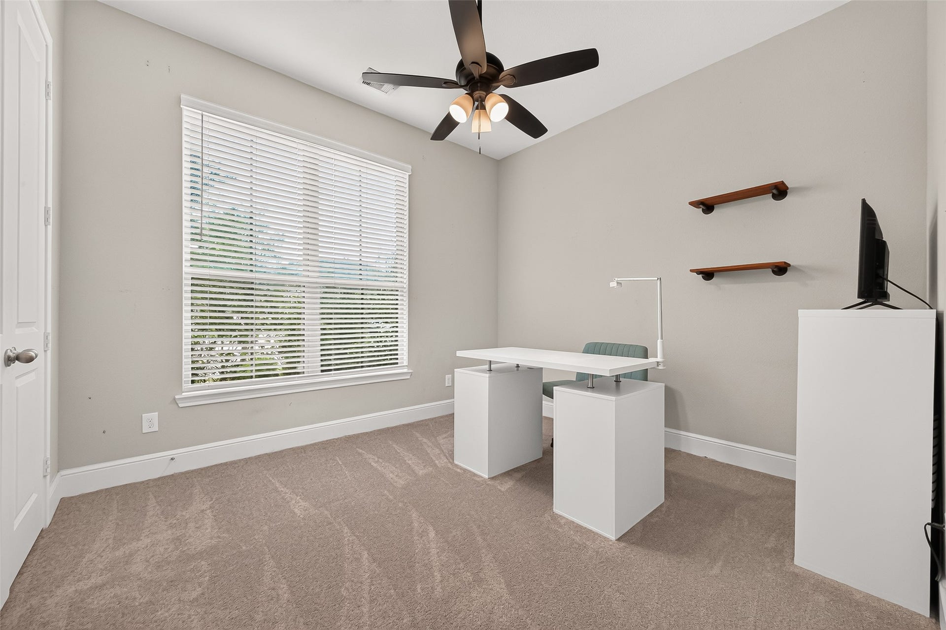 This room has easy access to the full bath. This makes a great guest room or home office space.